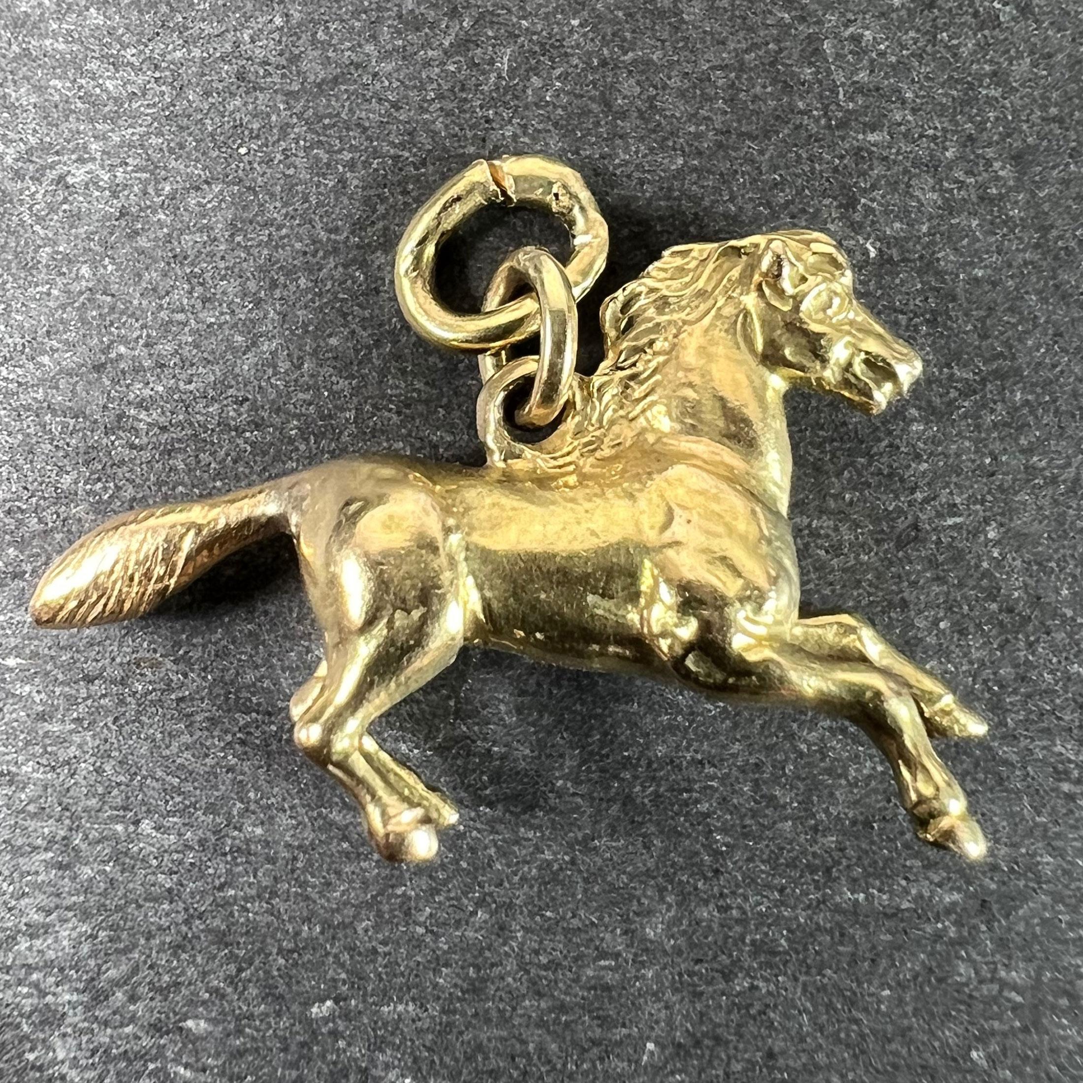 An 18 karat (18K) yellow gold charm pendant designed as a horse or pony. Unmarked but tested as 18 karat gold.

Dimensions: 1.5 x 2.5 x 0.55 cm (not including jump ring)
Weight: 3.94 grams
(Chain not included)