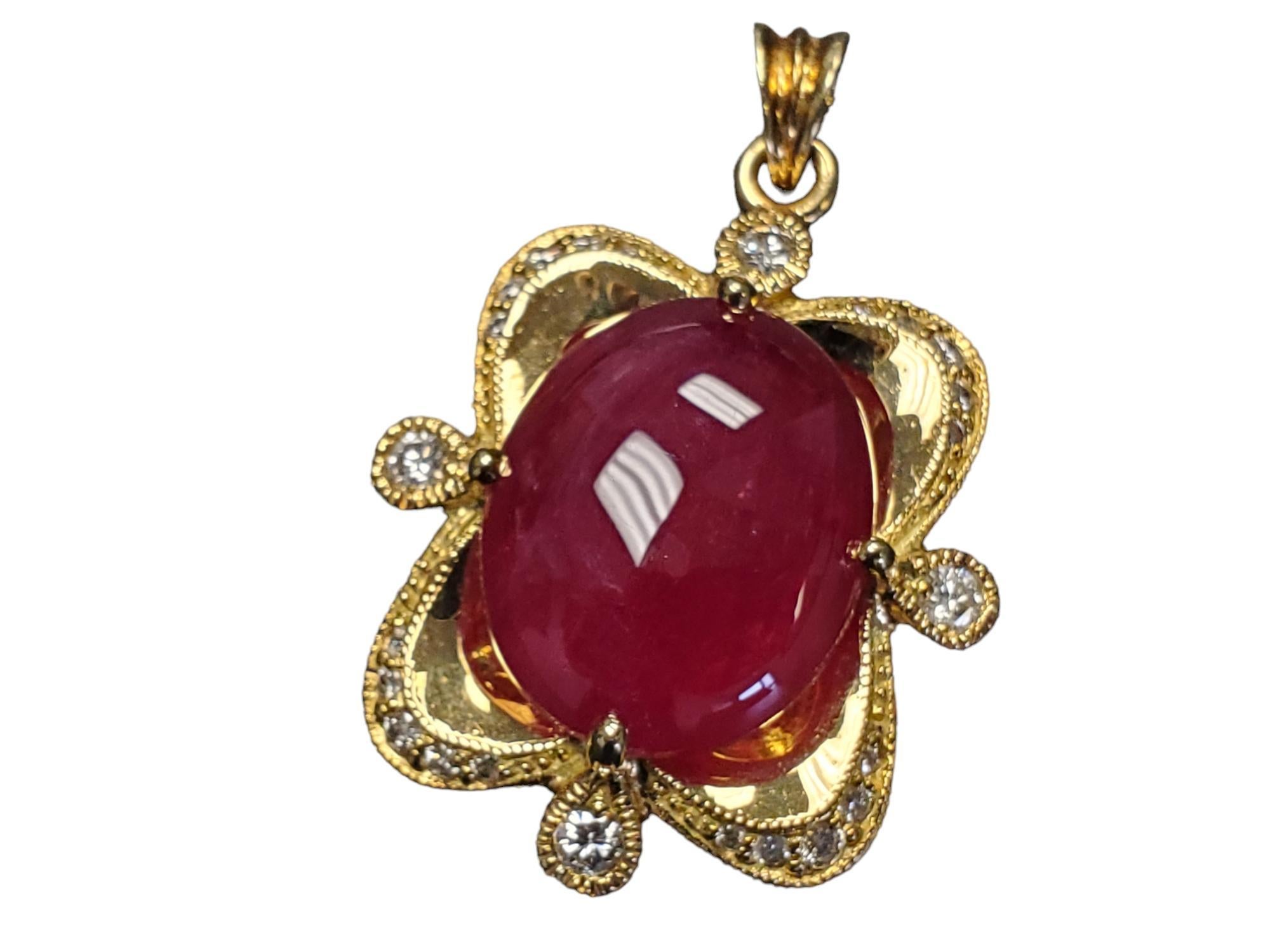 18k Yellow Gold Red Burma Ruby Diamond Pendant

Listed is an absolutely breathtaking vintage solid 18k yellow gold pendant with a large Burma Cabochon ruby. The piece is in great condition and it stamped on the back indicating that there are .80tcw