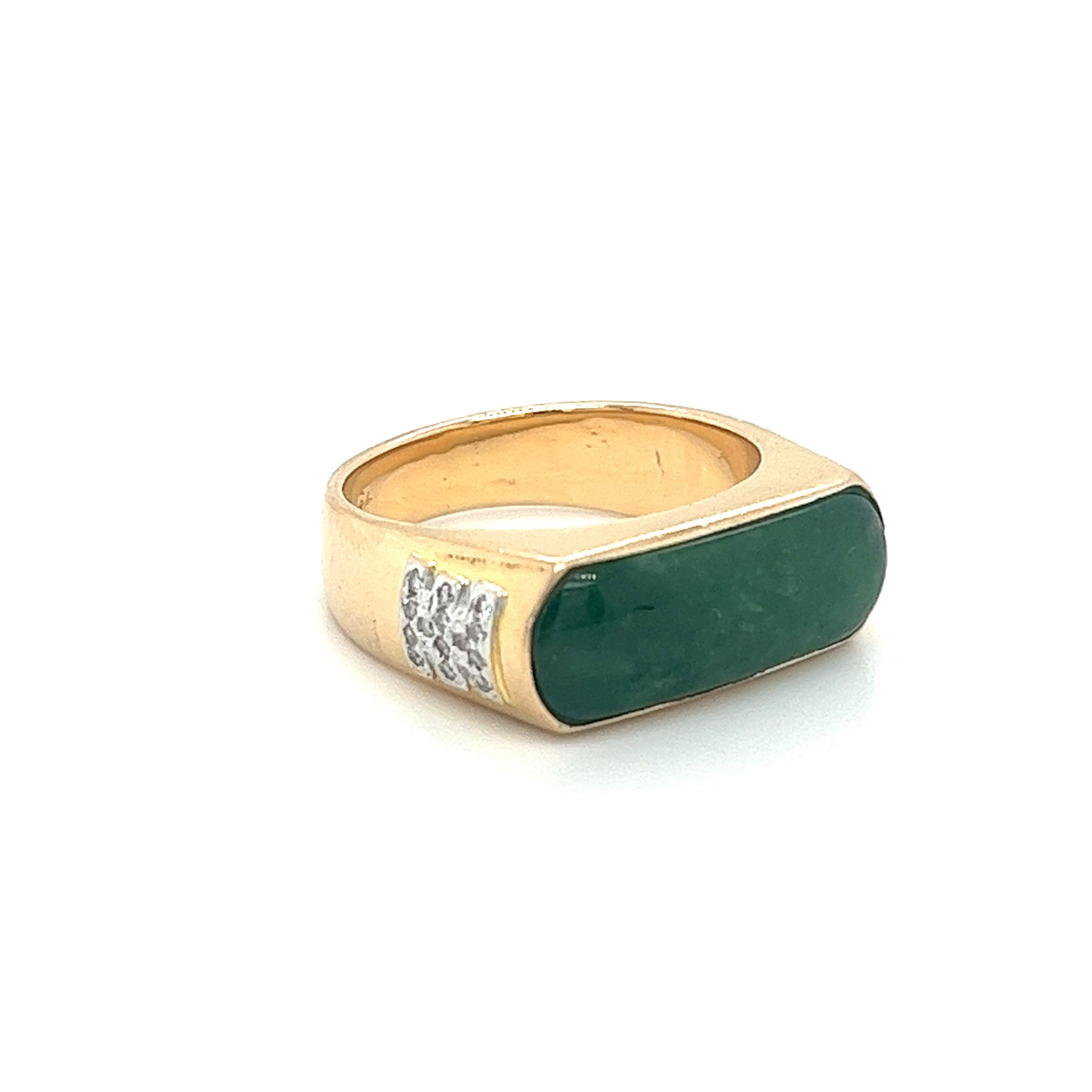 18K solid yellow gold unisex ring centering a stunning 19.0 x 6.7mm jadeite jade centerpiece. Accentuated by 28 round cut diamonds totaling 0.20CTW. Set in a horizontal bezel setting. A perfect blend of elegance and style, this ring is sure to make