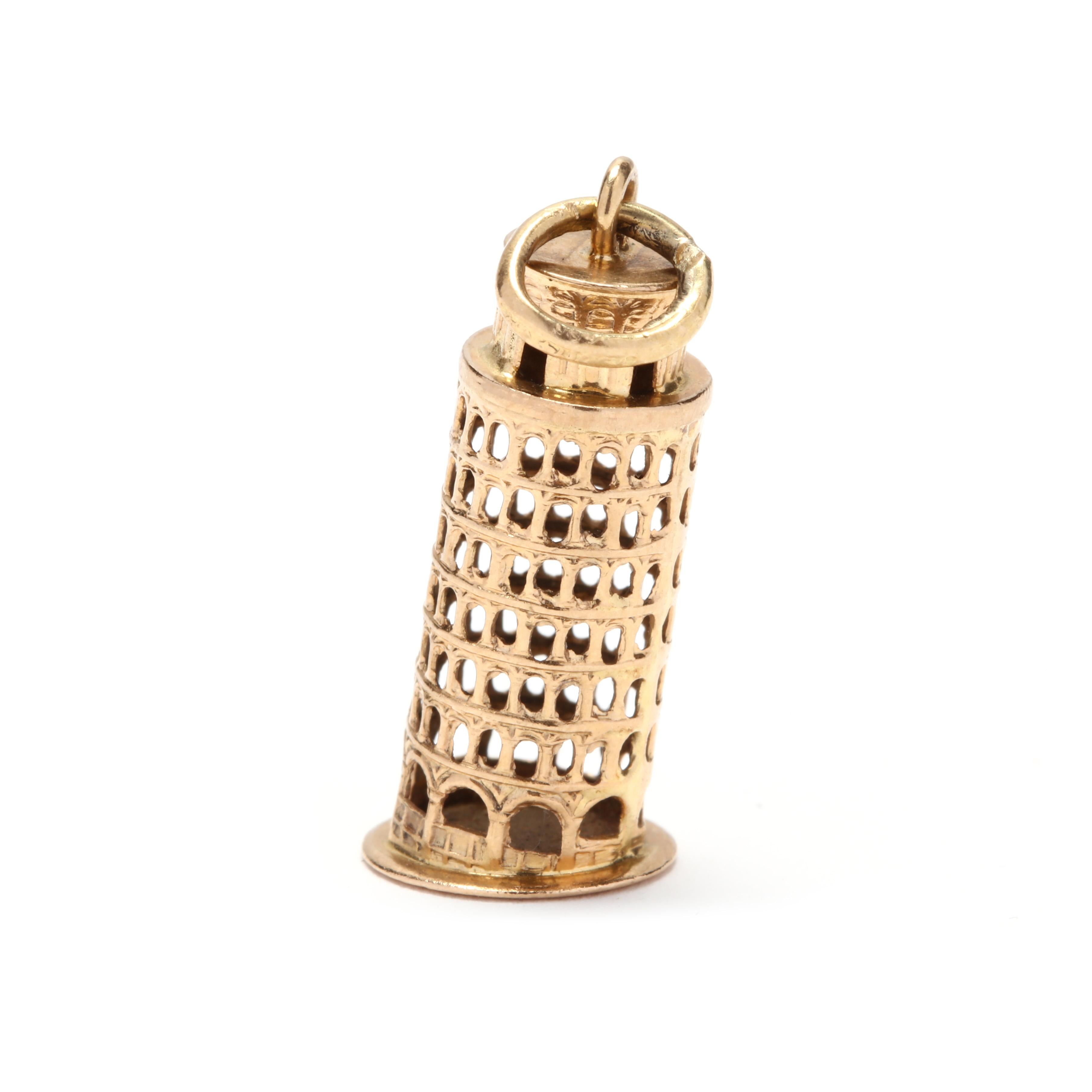 A vintage 18 karat yellow gold leaning tower of Pisa charm / pendant. This pendant features the leaning tower of Pisa motif with cutout windows and doors and with engraved detailing.

Length: 1.25 in.

2.19 dwts.

* Please note that this is a