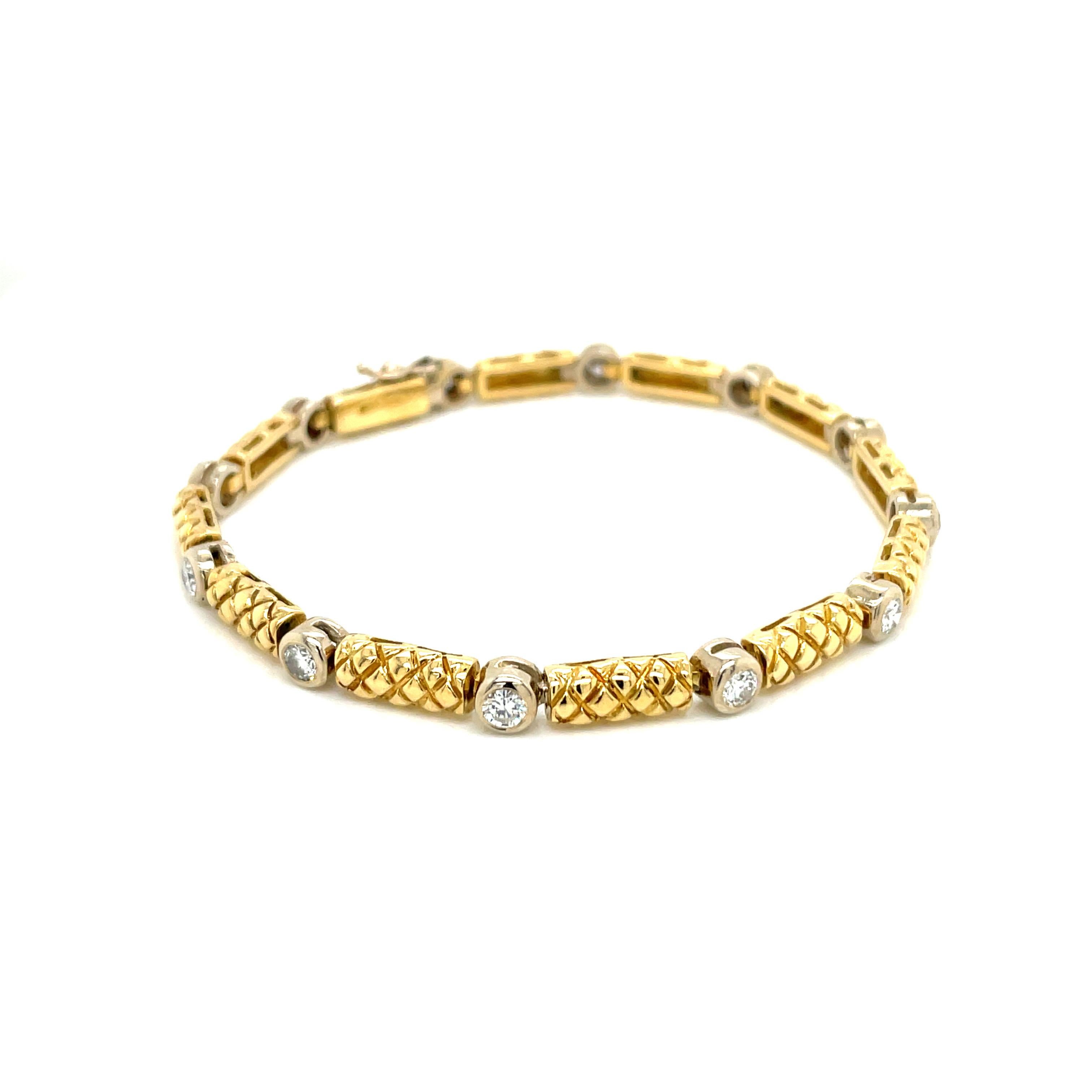 Vintage 18k yellow gold Link and Diamond Bracelet. The 18k solid gold link bracelet has a textured design. There are 12 round brilliant diamonds set in 18k white gold bezels and weigh approximately 2.00ct total weight. The diamond quality is G - H