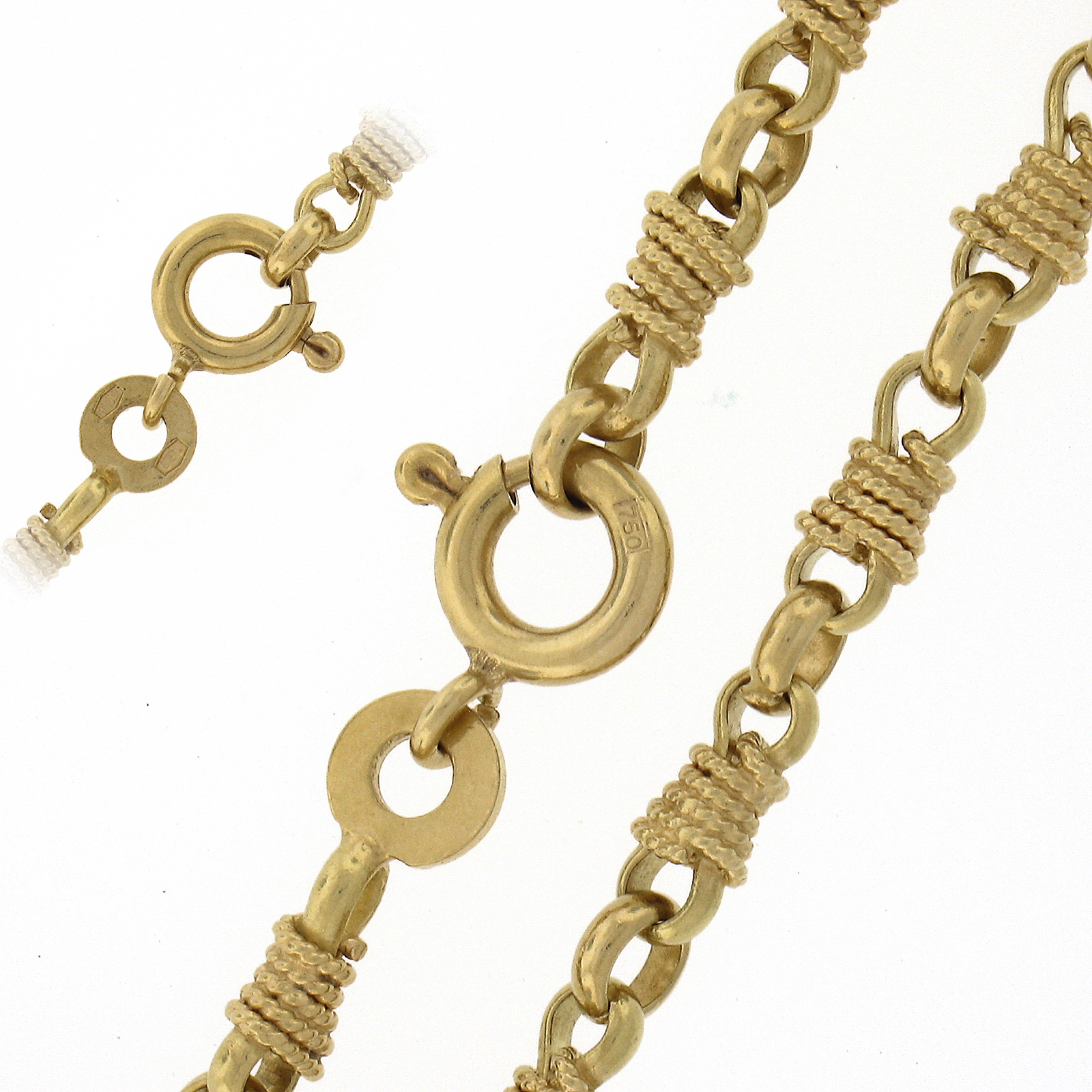 This Stunning and very well made vintage chain link necklace was crafted from solid 18k yellow gold and features a wrapped twisted wire fancy links. The necklace shows a polished & textured finishing and measures 28 inches.This necklace wears