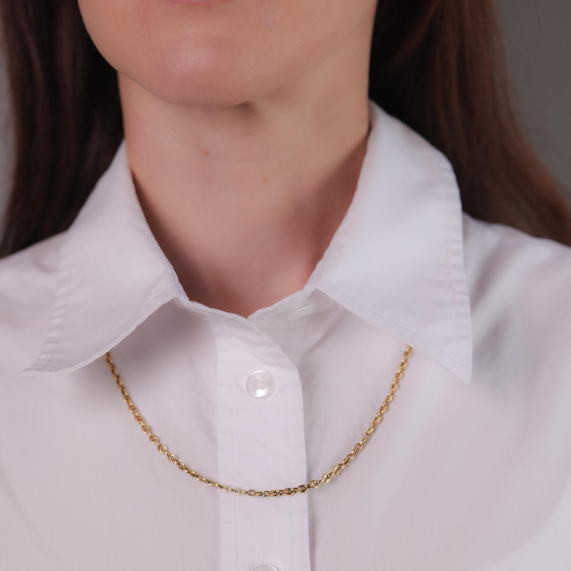 A sleek and versatile vintage 18k gold chain, embodying timeless elegance with a warm glow, perfect for layering or standalone wear.

Metal: 18k yellow gold
Era: Vintage
Circa: 1970's
Hallmarks: Purity mark and makers mark
Size: 21 inches long
Gram