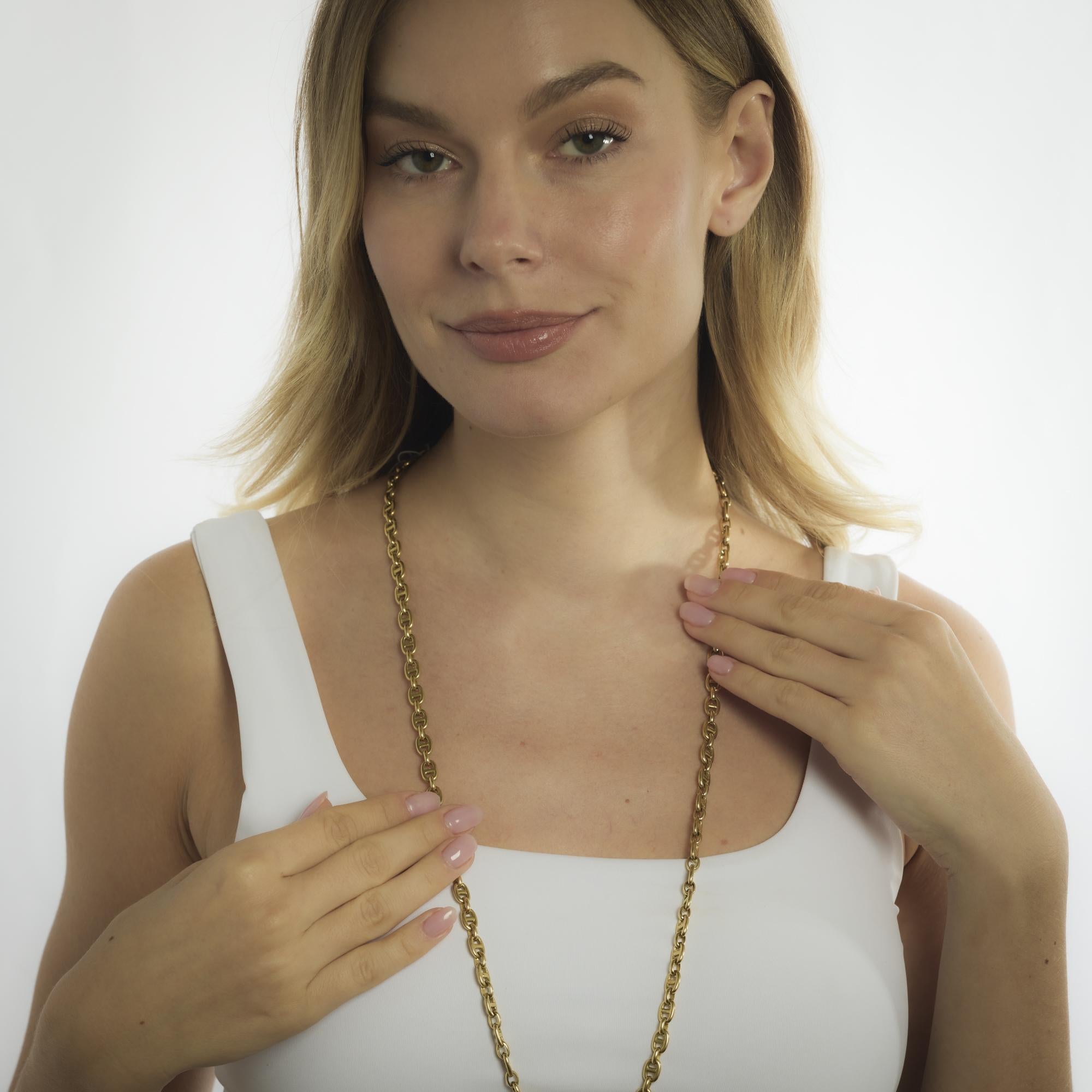 This vintage 18k yellow gold chain from the 1970’s offers a substantial weight and rich golden hue, perfect for wearing long, doubled, or layered. Its classic design and generous 32.50-inch length make it a versatile piece that transitions