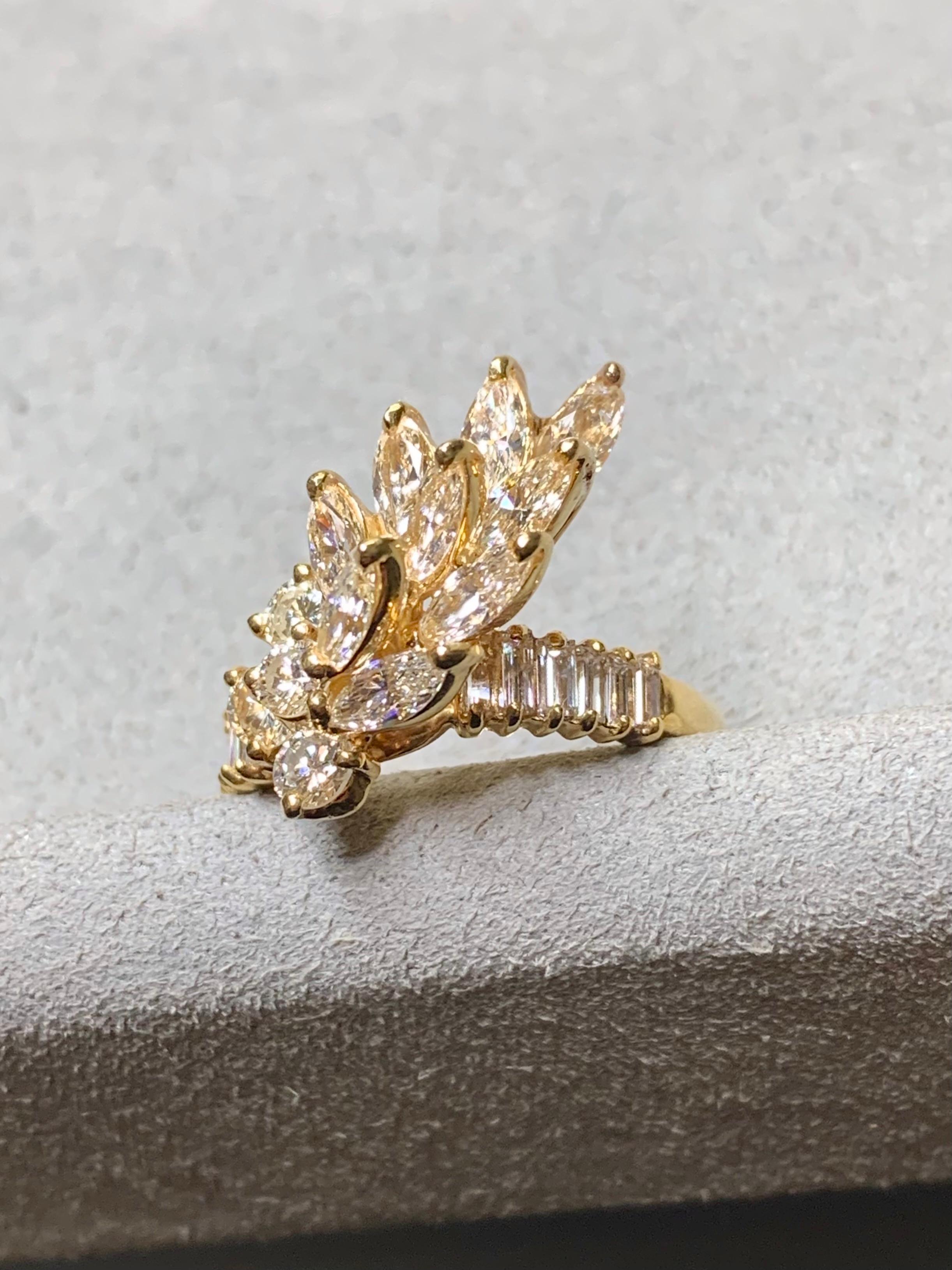 A vintage cocktail ring circa the 1960’s done in 18K yellow gold (numbered) and prong set with approximately 2.40ctw in baguette, marquise and round diamonds. All stones are a matching H-I color and Vs1-2 clarity.


Dimensions/Weight:

Ring measures
