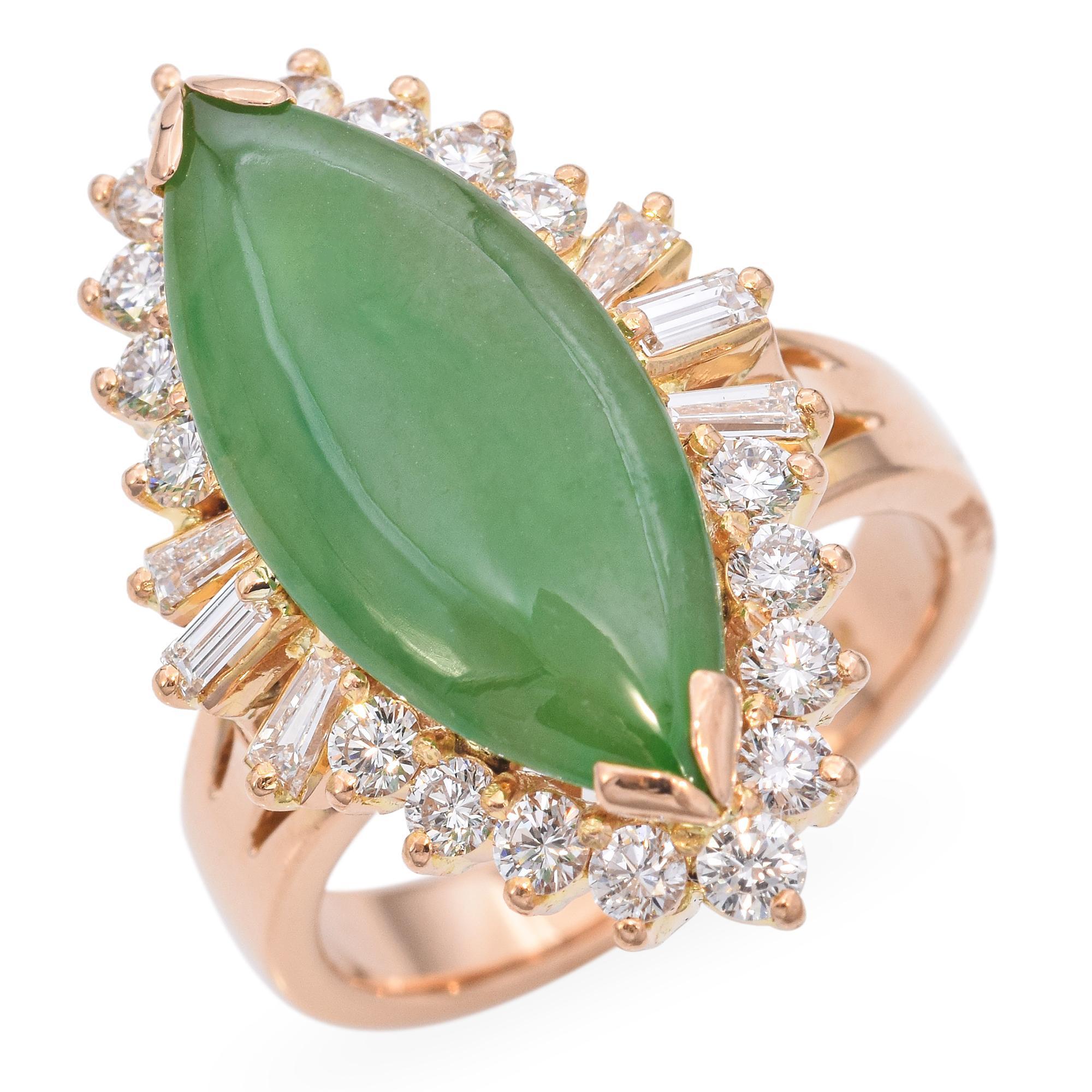 Elegant 18k Yellow Gold Jade and Diamond Ring. This exquisite ring features a marquise-cut jade as the centerpiece, surrounded by a halo of sparkling white diamonds. The setting is crafted in luxurious 18k yellow gold, enhancing the vibrant green of