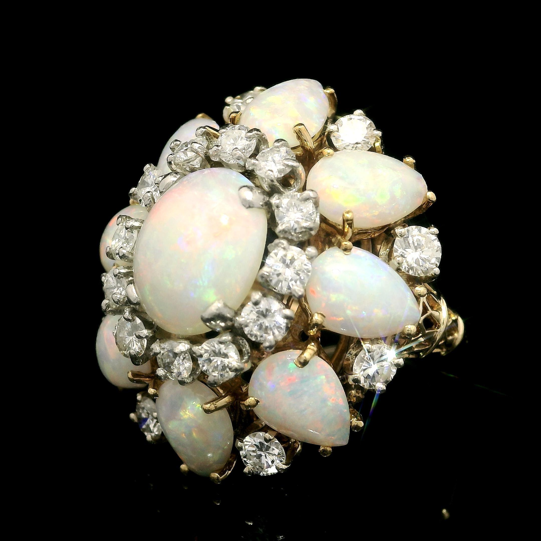 --Stone(s):--
(9) Natural Genuine Opal - 1 Oval Cabochon Cut 9 Pear Cabochon Cut - Prong Set - White Color w/ Some Light Play of Green, Orange, & Violet Color - 10x8.3mm (oval), 5.27x7.25mm (pear each) (approx.)
(20) Natural Genuine Diamonds - Round