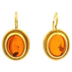 Orecchini a goccia ovali cabochon in ambra d'epoca in oro giallo 18 ct.