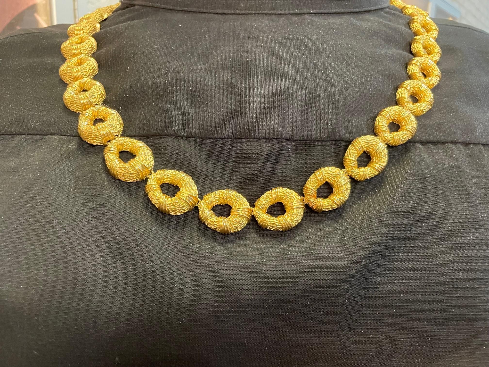 Vintage 18K yellow gold 34 inch oval link necklace.  The necklace has a box
clasp and a textured finish.  The necklace weighs 186dwt., circa 1970s. 