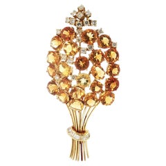 Spilla vintage in oro giallo 18 carati con diamanti rotondi e a baguette per un totale di 2 carati e citrino