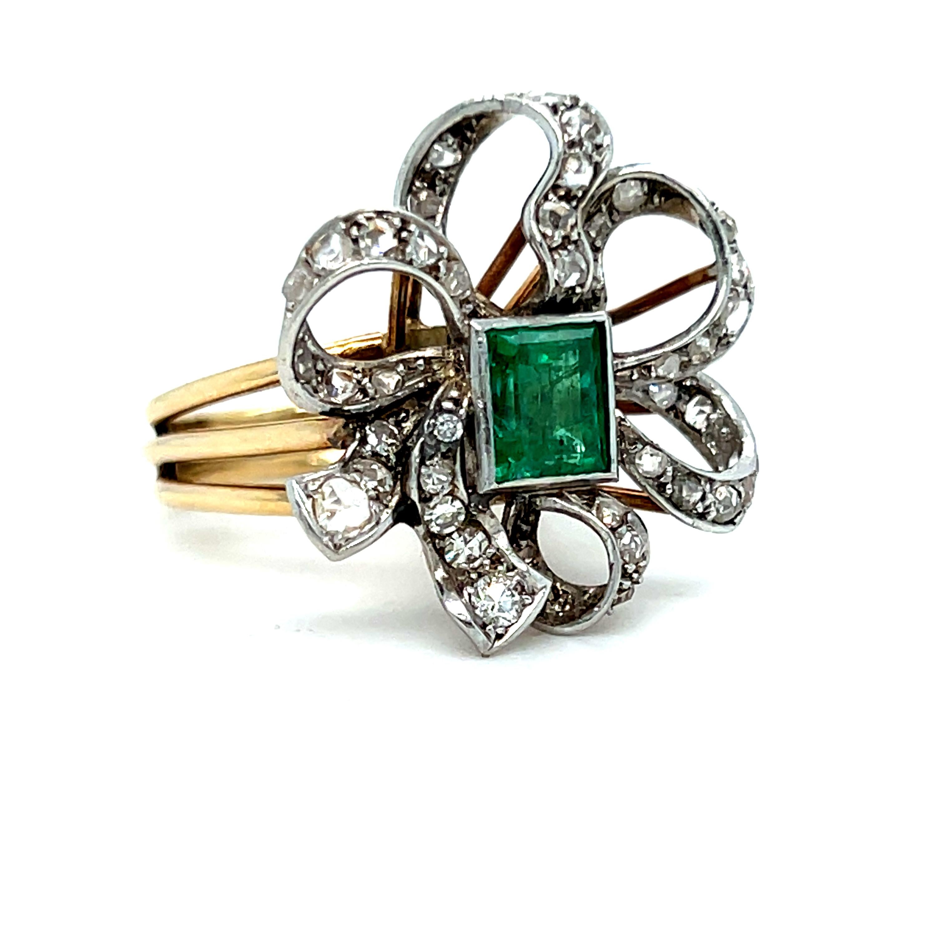 This Vintage 18K Yellow Gold/ Platinum Emerald and Diamond Ribbon Style Ring is just so unique and gorgeous- I LOVE it!! Crafted in 18K Yellow Gold, the design features an amazing ribbon entirely paved in antique diamonds, surrounding a gorgeous