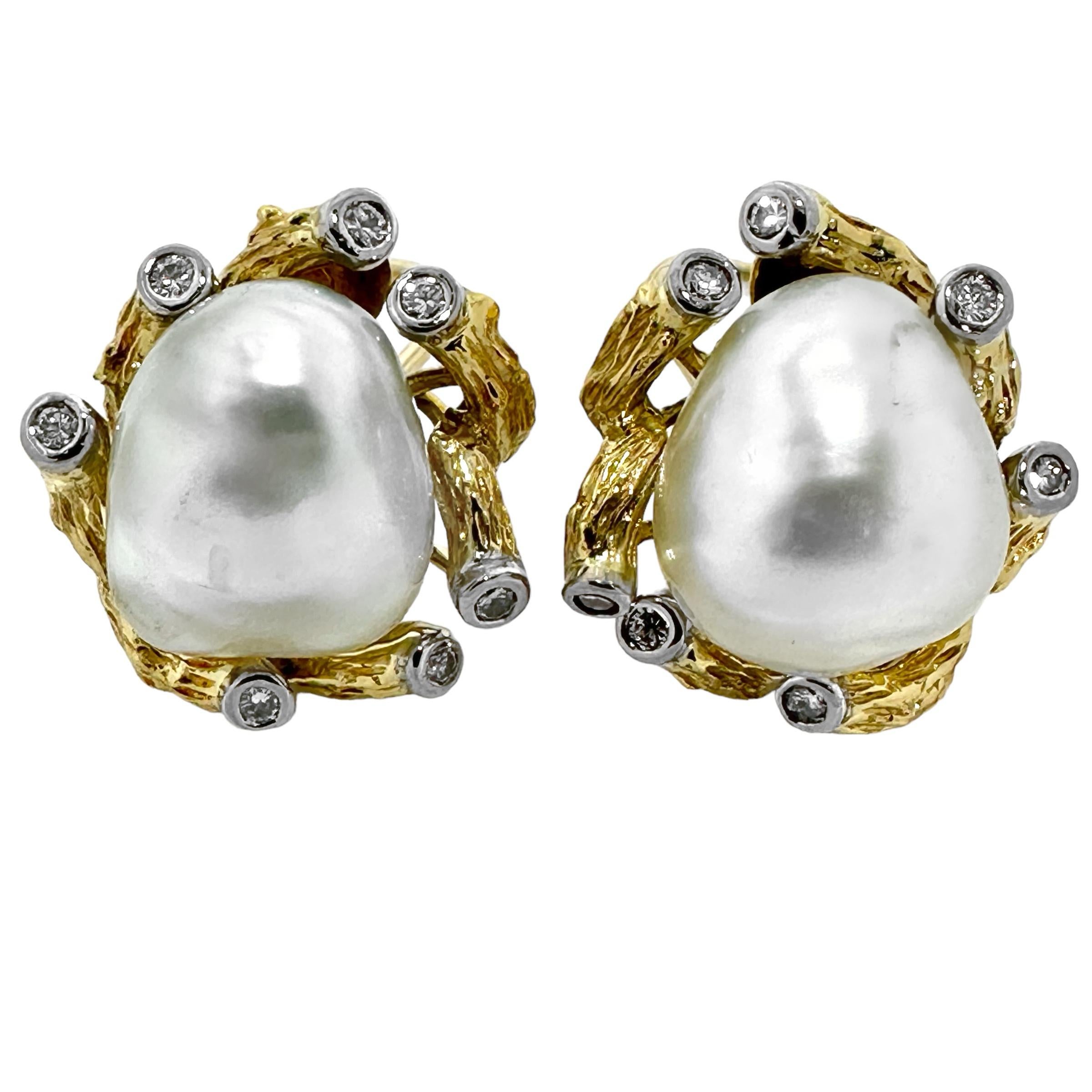 This unique pair of Trio, Mid-20th Century, 18k yellow gold, platinum, semi-baroque pearl and diamond foliate motif earrings has a natural, organic feel. Two 16mm semi-baroque, silver white, lustrous cultured pearls are nestled in a field of deep