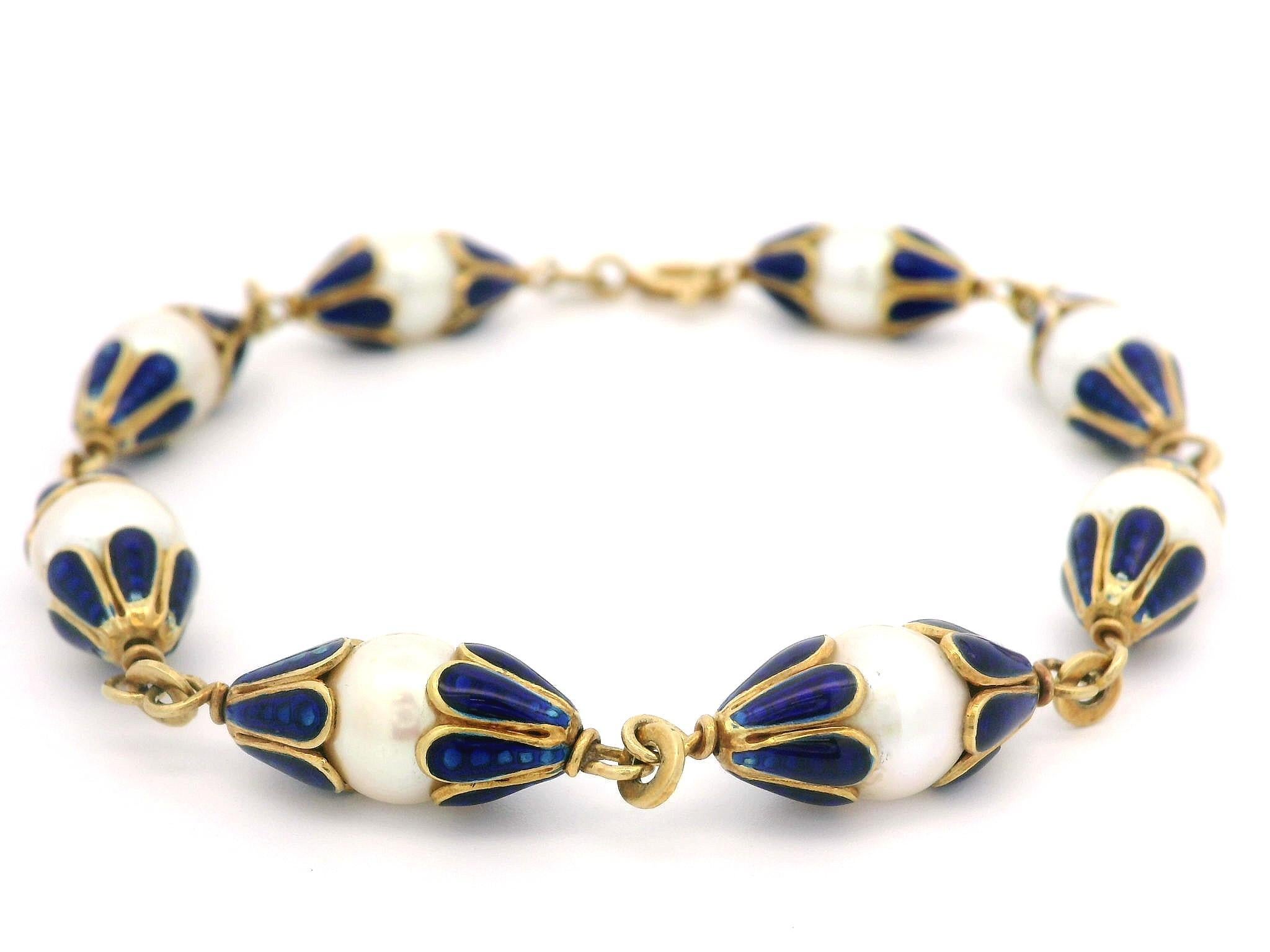 --Stone(s):--
(8) Genuine Cultured Pearls - Round Shape - Creamy White Color - 7.3mm each (approx.)

Material: 18K Solid Yellow Gold w/ Royal Blue Enamel Work
Weight: 14.22 Grams
Size: Measure 7.5 Inches Next to a Ruler. Will Comfortably Fits up to