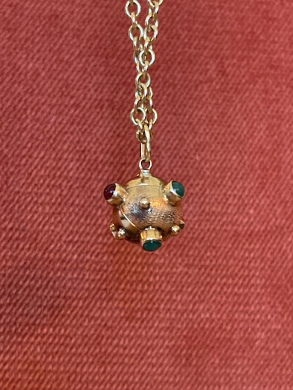 Vintage 18k yellow gold highly coveted Sputnik Charm set with ruby and emerald cabochons in fabulous condition. 

Whether called a sputnik orb, sphere or globe charm, these round 3-dimensional ornate ball charms are highly collectible. 

We love