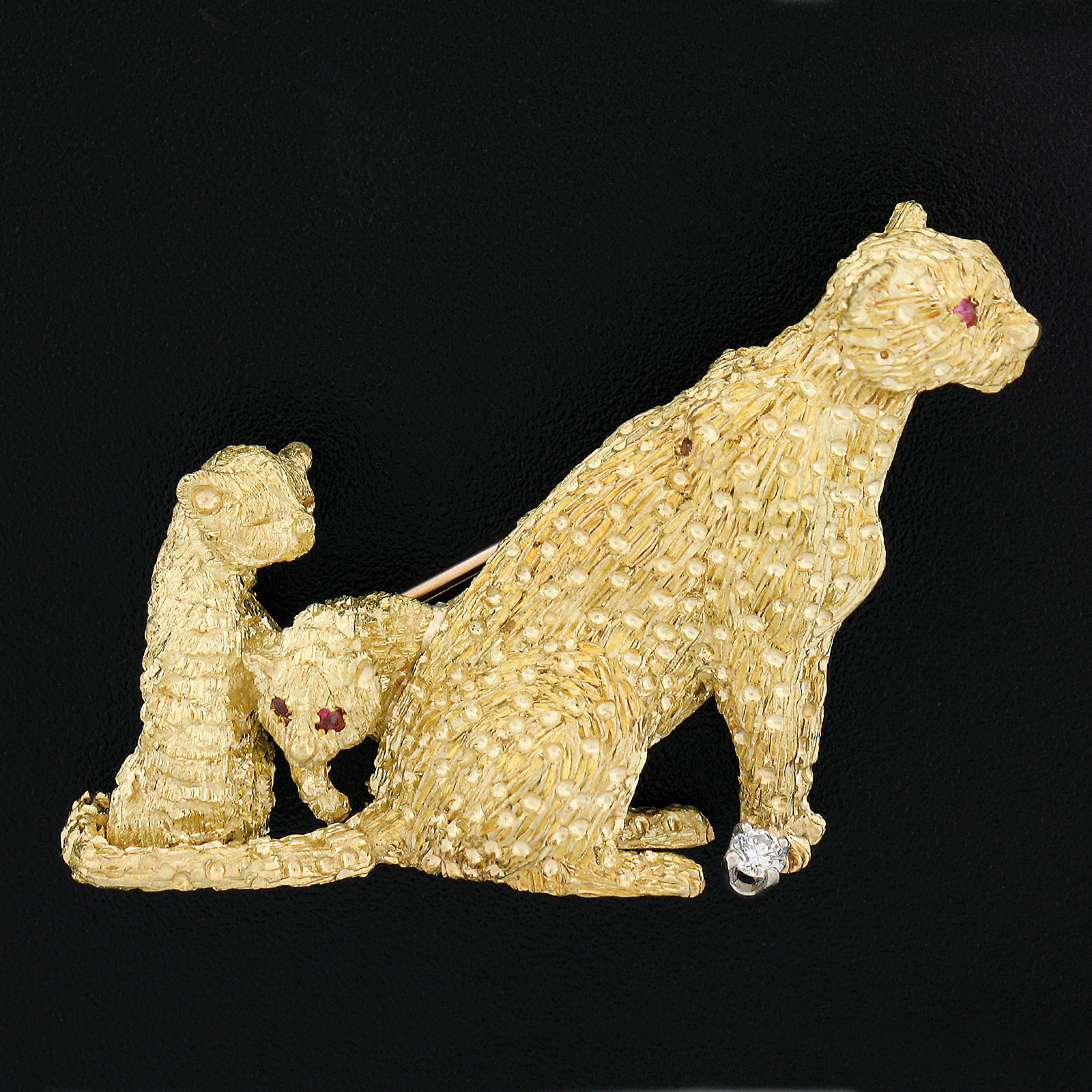 This incredible and very well made pin brooch is crafted in solid 18k yellow gold. It features a perfectly structured cheetah family design with remarkably outstanding workmanship and texture that bring out maximum detail granting a truly