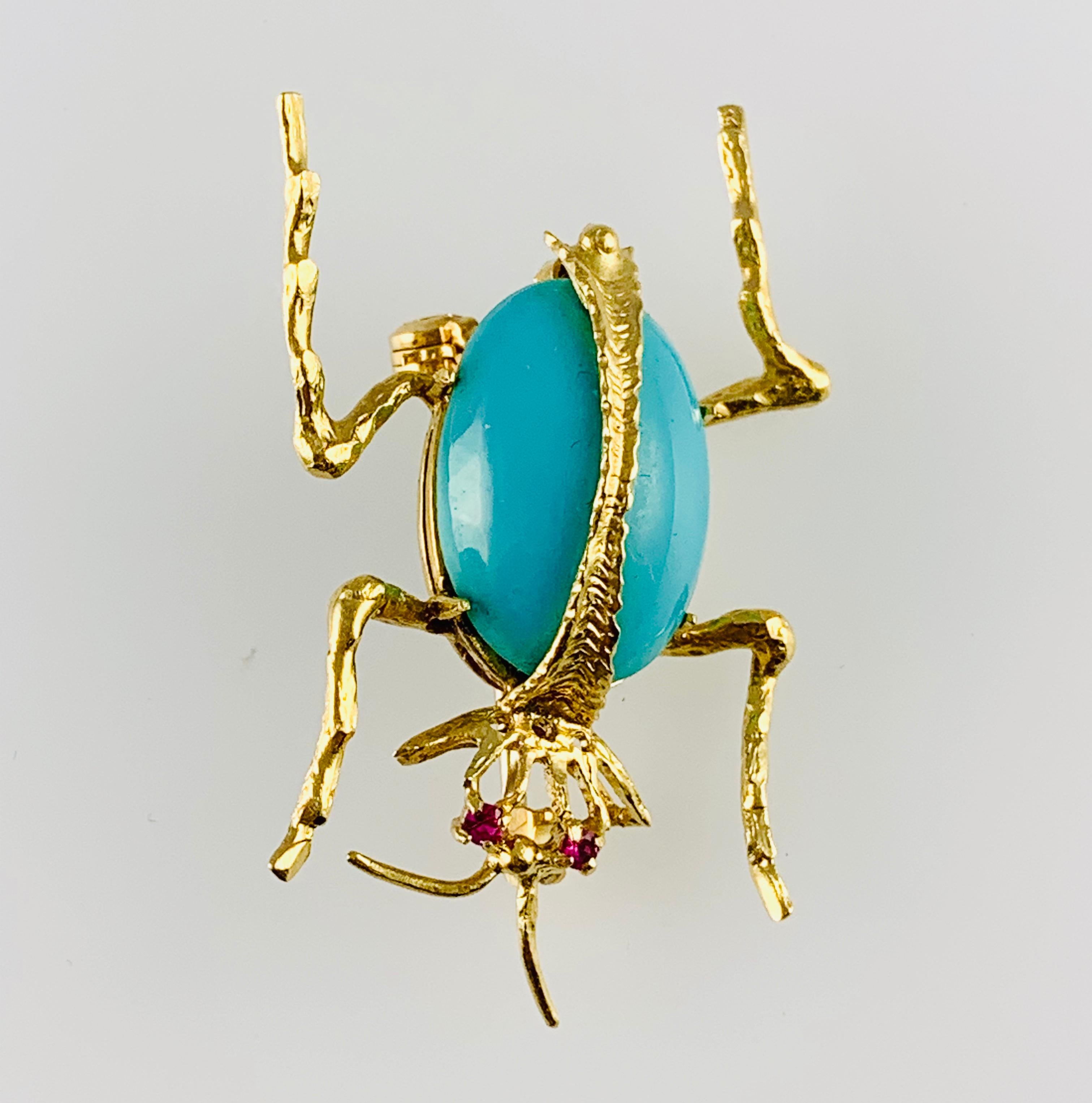 Gorgeous Vintage Beetle Brooch! Made in 18K yellow Gold it features an 18 by 13 mm Oval    
Turquoise stone as the body with two Ruby eyes. It  measures 1.5 inches by 1 inch and weighs 7.5 grams.