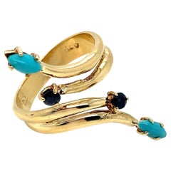 Bague vintage en or jaune 18K en forme de S avec turquoise et saphir