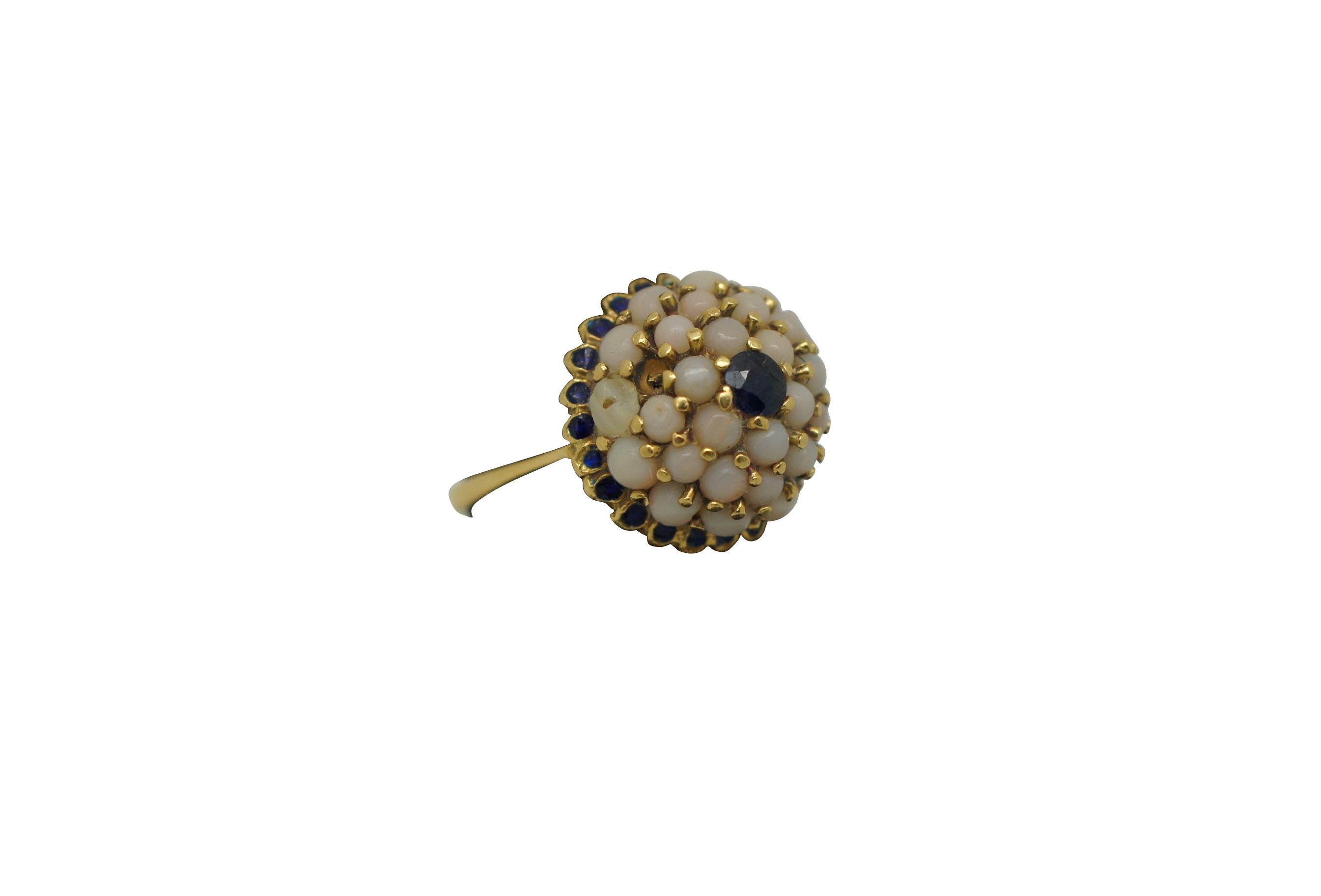Vintage 18K yellow gold cocktail ring featuring a dome cluster of pearls with sapphire at the center and surrounding the base.

Dimensions:
0.75
