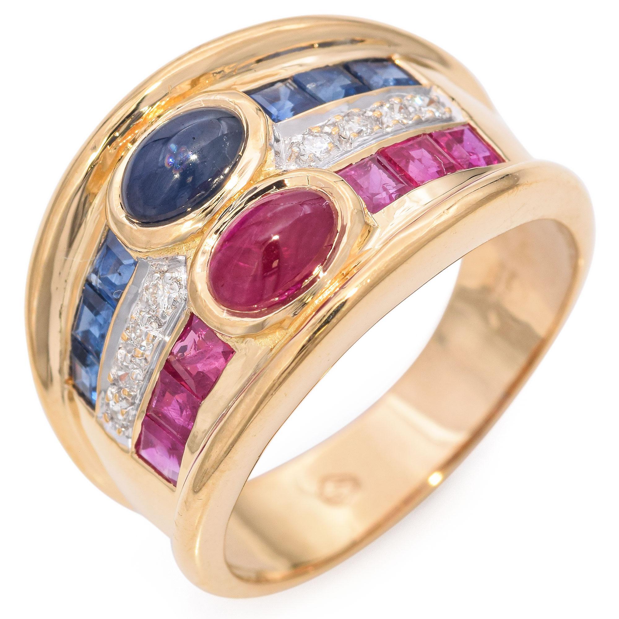 The design showcases a central oval ruby and sapphire, each surrounded by a row of square-cut rubies and sapphires. A row of sparkling diamonds adds a touch of brilliance between the colored stones. Set in polished gold, this piece exudes elegance