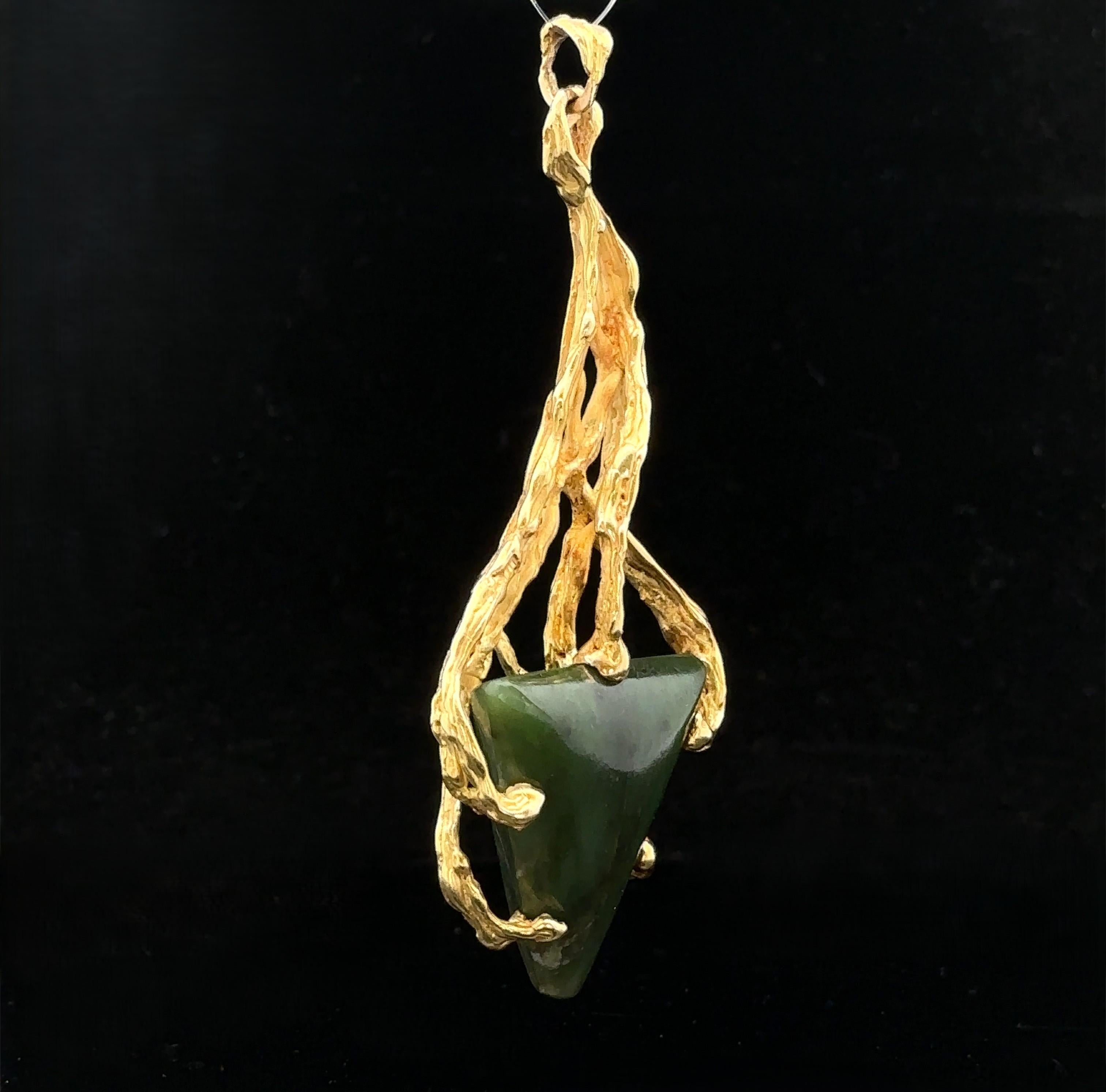 –Stone(s)–
(1) Natural Genuine Nephrite Jade - Triangular Cabochon Cut - Prong Set - Green Color - 30x26.2mm (approx.)

Material: Solid 18k Yellow Gold
Weight: 30.7 Grams
Overall Height: 83.4mm (3.2