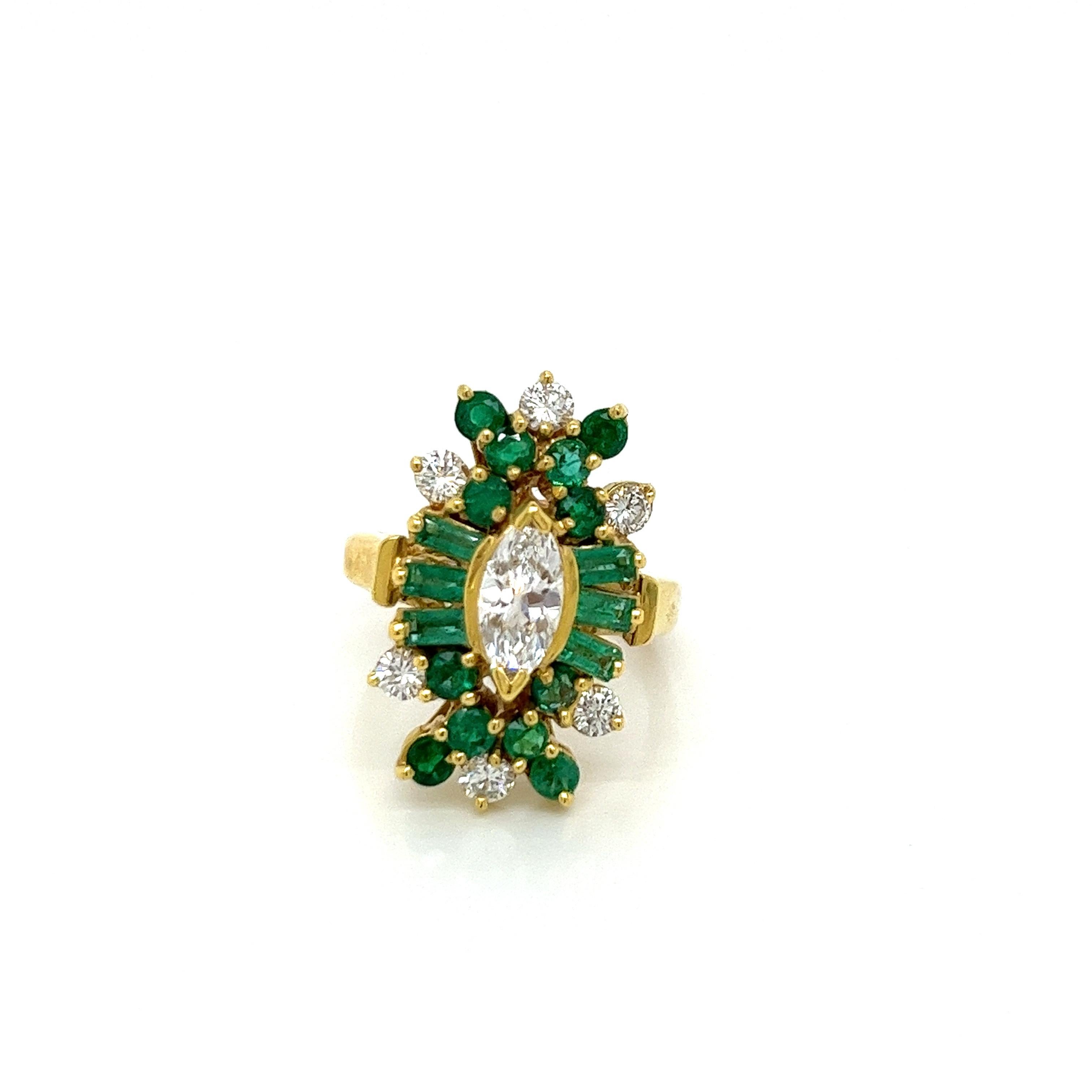 Vintage 18k yellow gold Victorian Reproduction Diamond and Emerald Ring - The center marquise diamond measures 8.5 x 4.2mm and weighs approximately .75ct. The diamond has a quality of F color and SI1 clarity. One either side of the marquise diamond