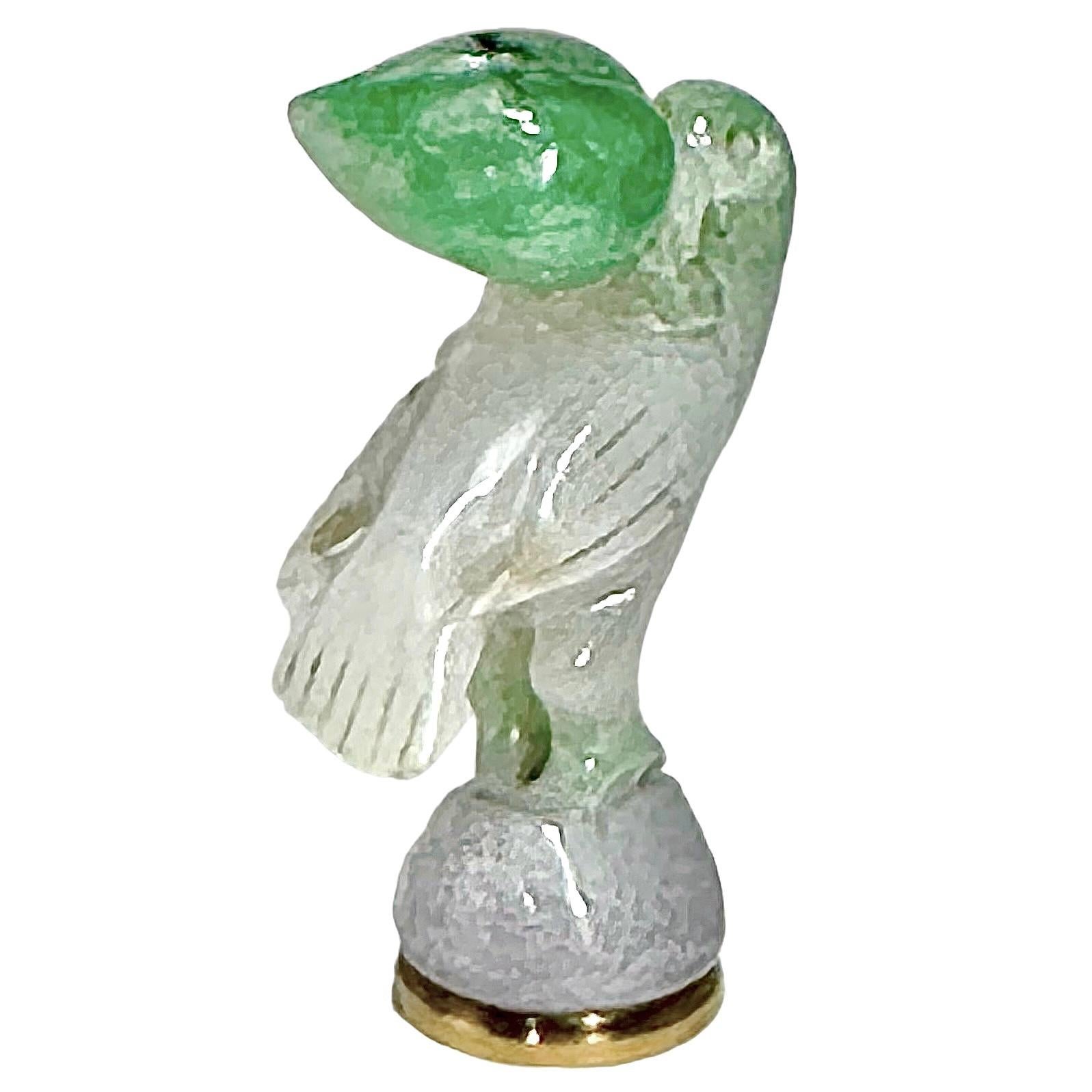 This unique, Circa 1800, wax seal begins with an 18K yellow gold base monogrammed with MLO, upon which sits a beautifully carved jade bird. The Jade starts at the top with a subtle, beautiful apple color and finishes with a lavender colored