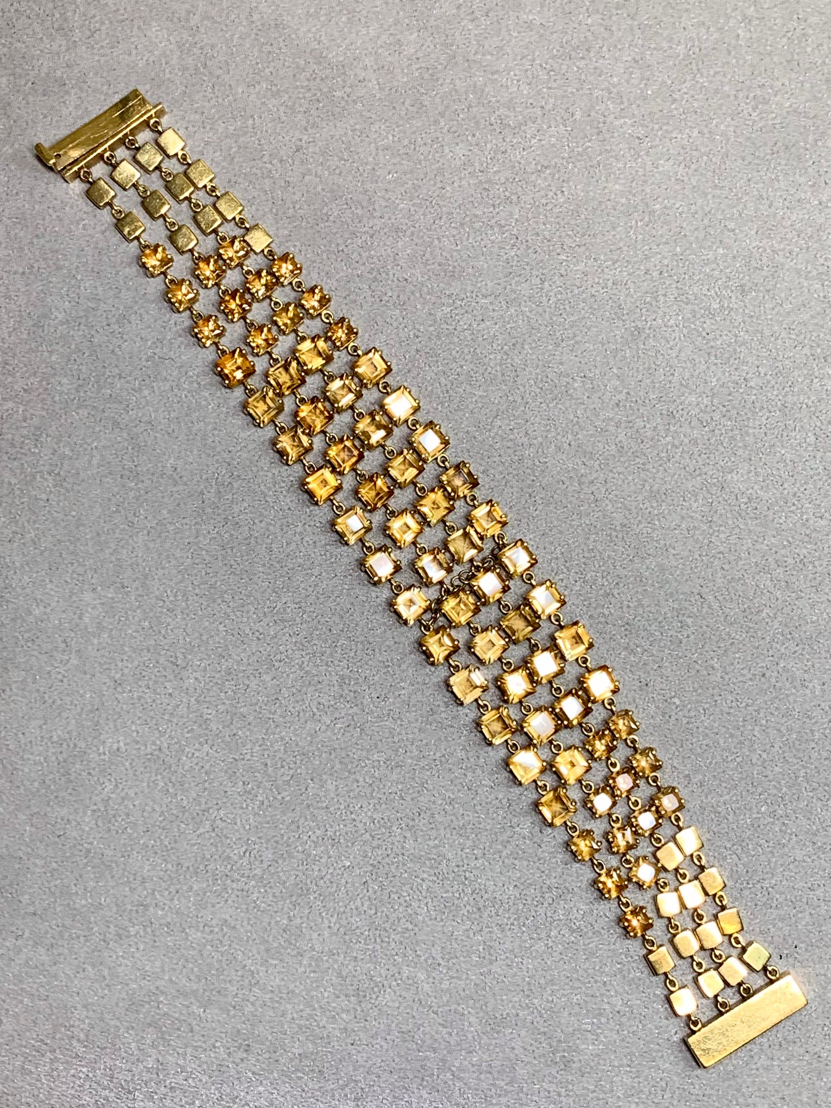 This exceptional Retro era bracelet from the 1950s showcases elegance and craftsmanship at its finest. Made in rich 18K yellow gold, it features four wide strands of luminous natural citrines totaling approximately 45 carats. Bold in design and