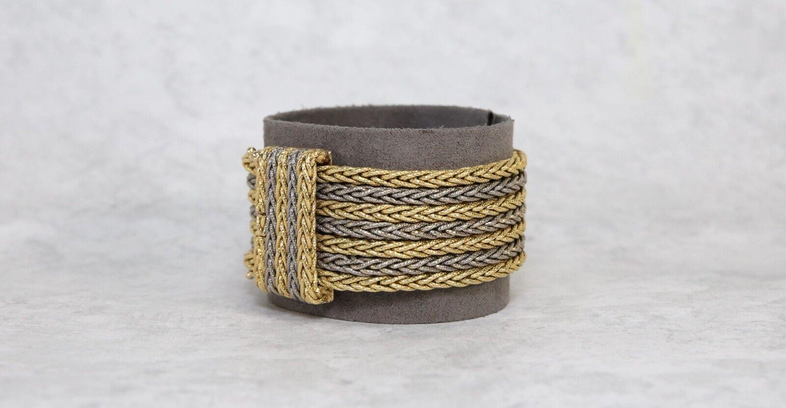 Enhance your wardrobe with this elegant heavy woven vintage bracelet. Hand crafted in a high quality 18k gold, each 3.5mm strand on this bracelet is textured and highly detailed in a woven boxed design. The seven strands alternate between yellow and