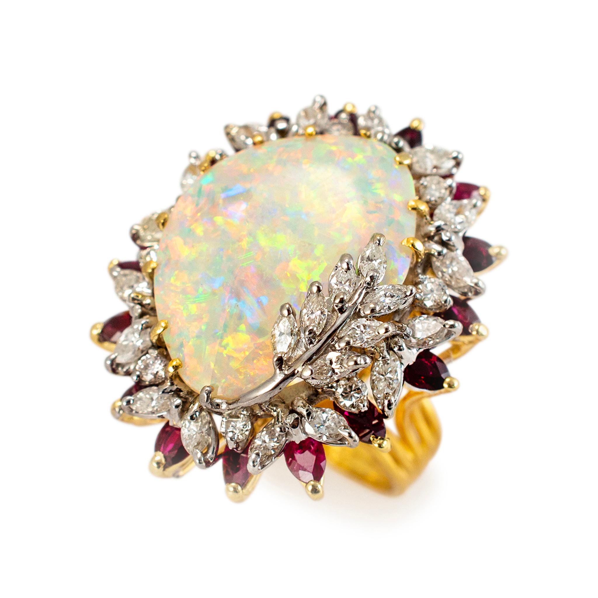 Gender: Ladies

Metal Type: 18K White & Yellow Gold

Ring Size: 7

Shank width: 3.25 mm

Weight: 17.88 grams

One ladies 18K white & yellow gold, diamond, ruby, and opal vintage halo cocktail ring with a split shank. The metal was tested and