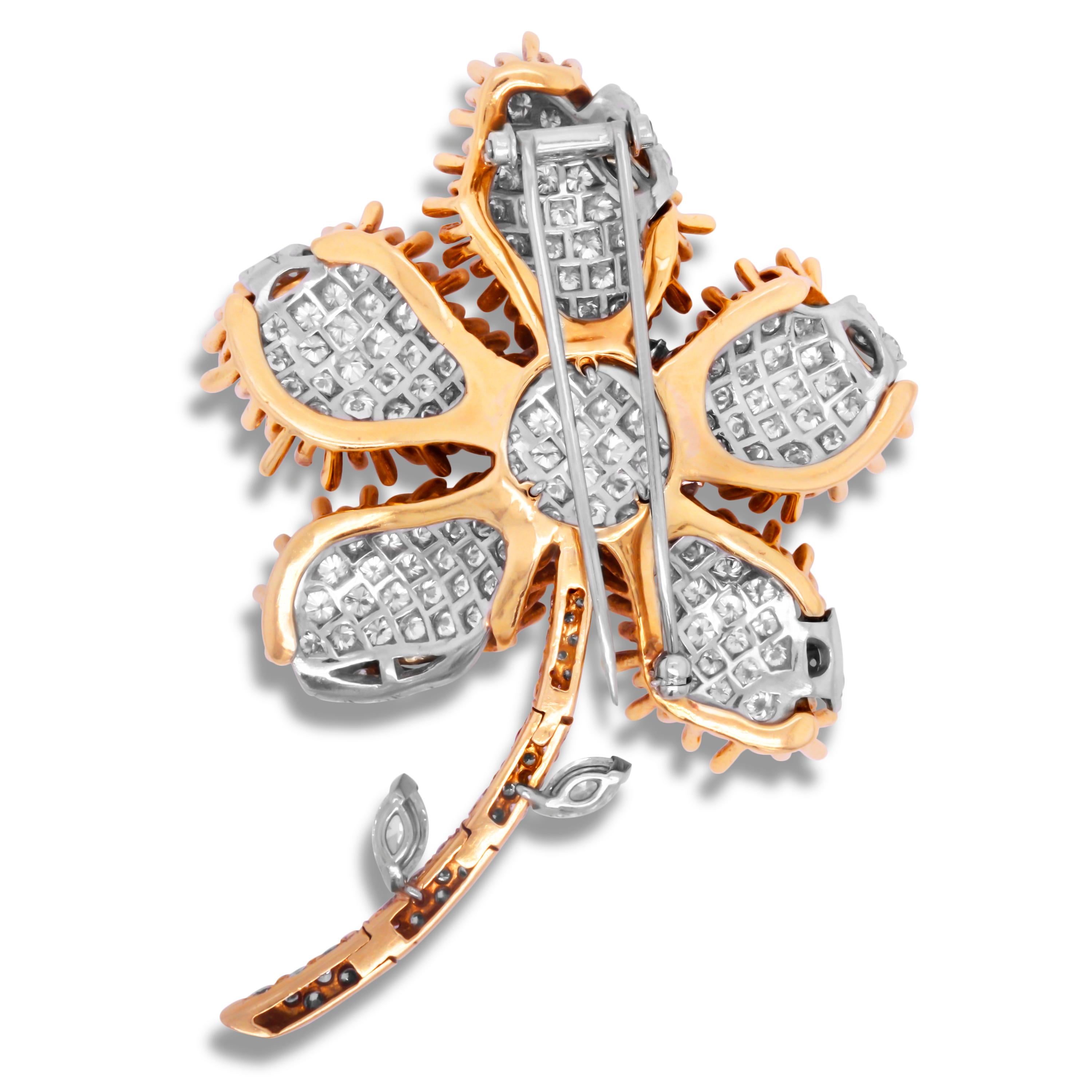 Vintage 18K Yellow White Gold Round and Marquise Cut Diamond Flower Brooch Pin

This incredible Brooch features a 3D, flower design with pavé set diamonds set all throughout. On the 