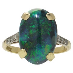 Vintage 18kt gold black opal and diamond ring.