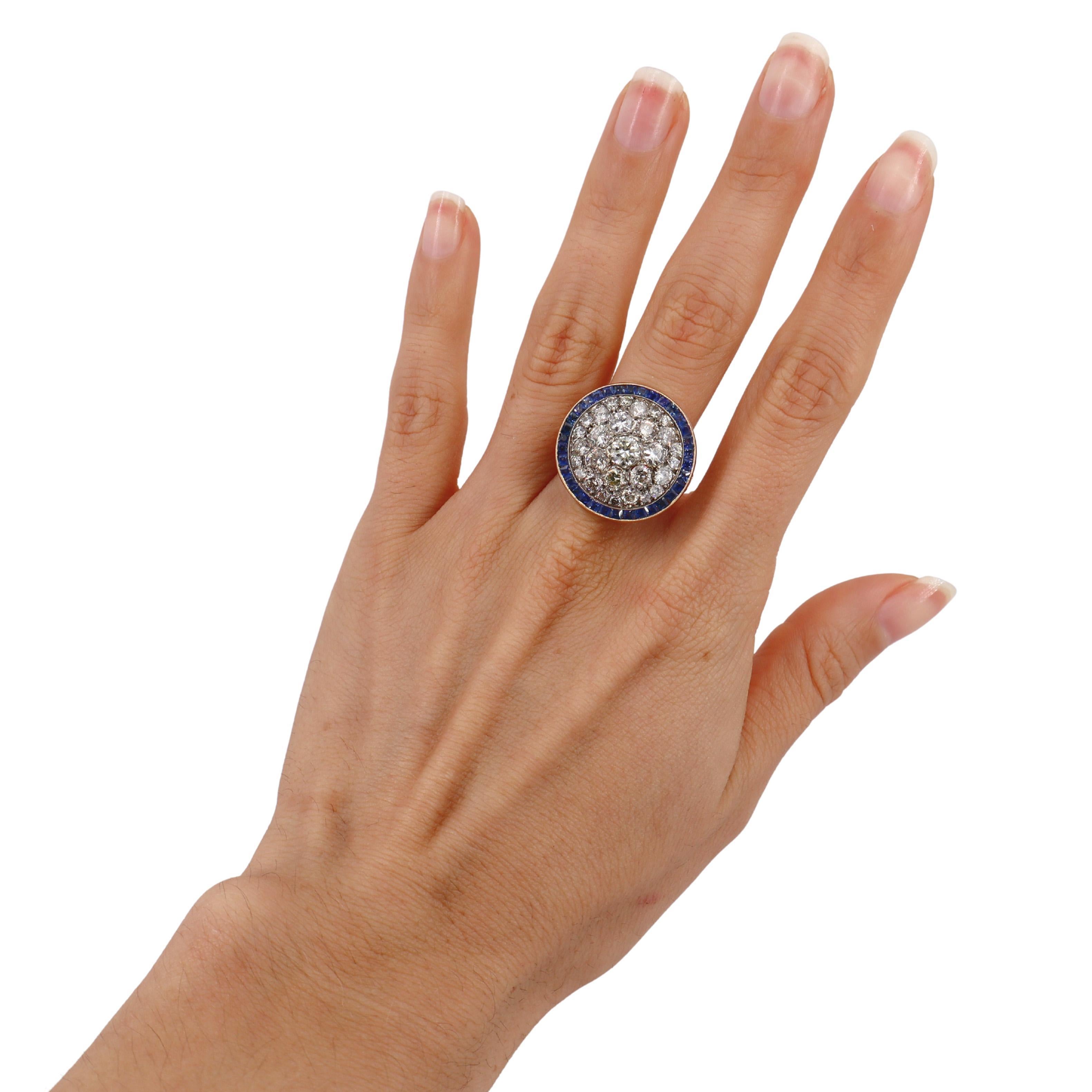 Introducing a stunning vintage round ring, meticulously crafted in 18kt yellow gold. This exquisite piece showcases a captivating pavé of Old Mine Diamonds, which collectively weigh approximately 2.50 carats. The diamonds exhibit a beautiful color