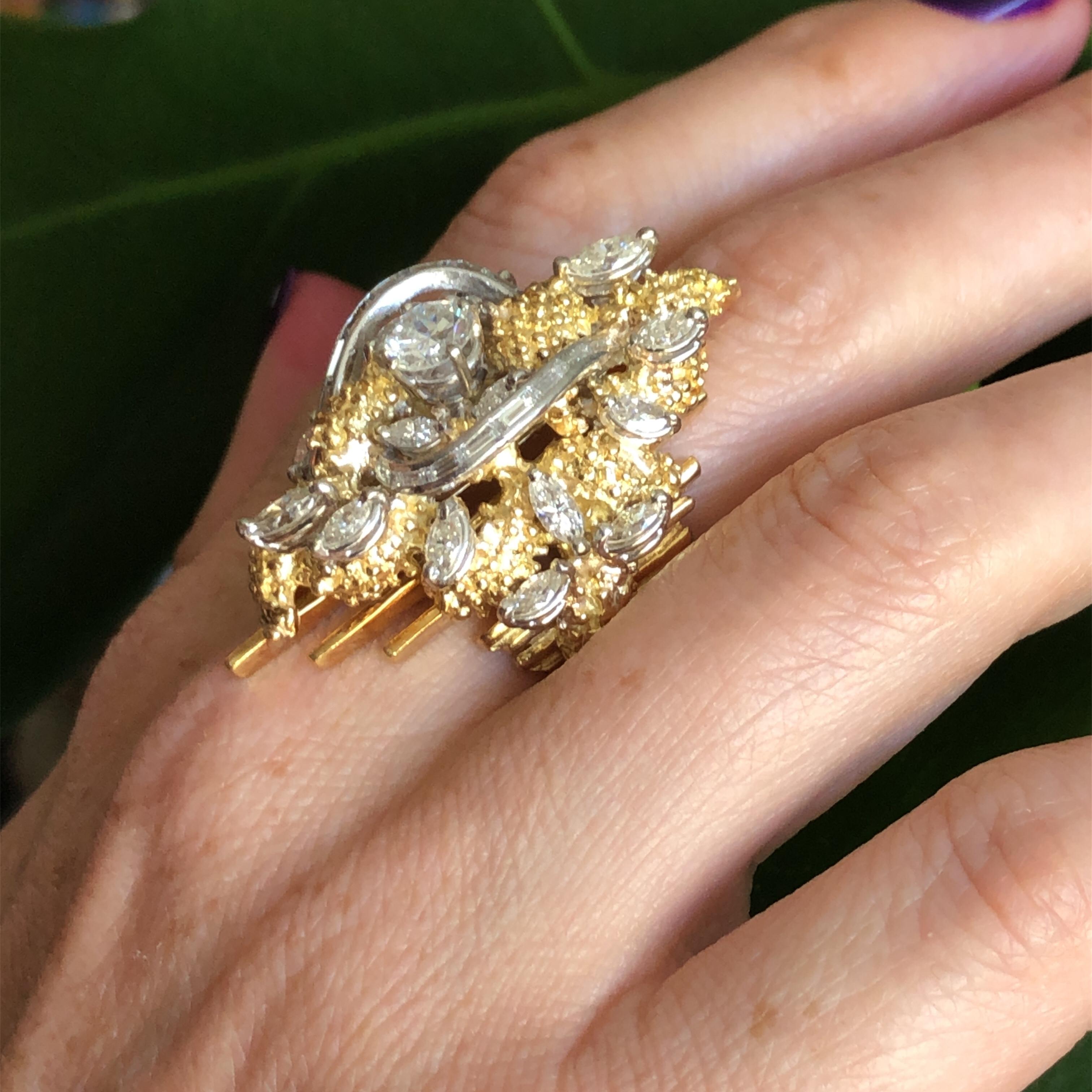 Offered here is large vintage one of a kind cocktail ring, circa 1960-70. 
Ring was handmade in solid 18 kt yellow and adorned with platinum set with diamonds. 
Centered with 1 round diamond weighing approximately 0.75 carat, ( 5.80 mm ), near