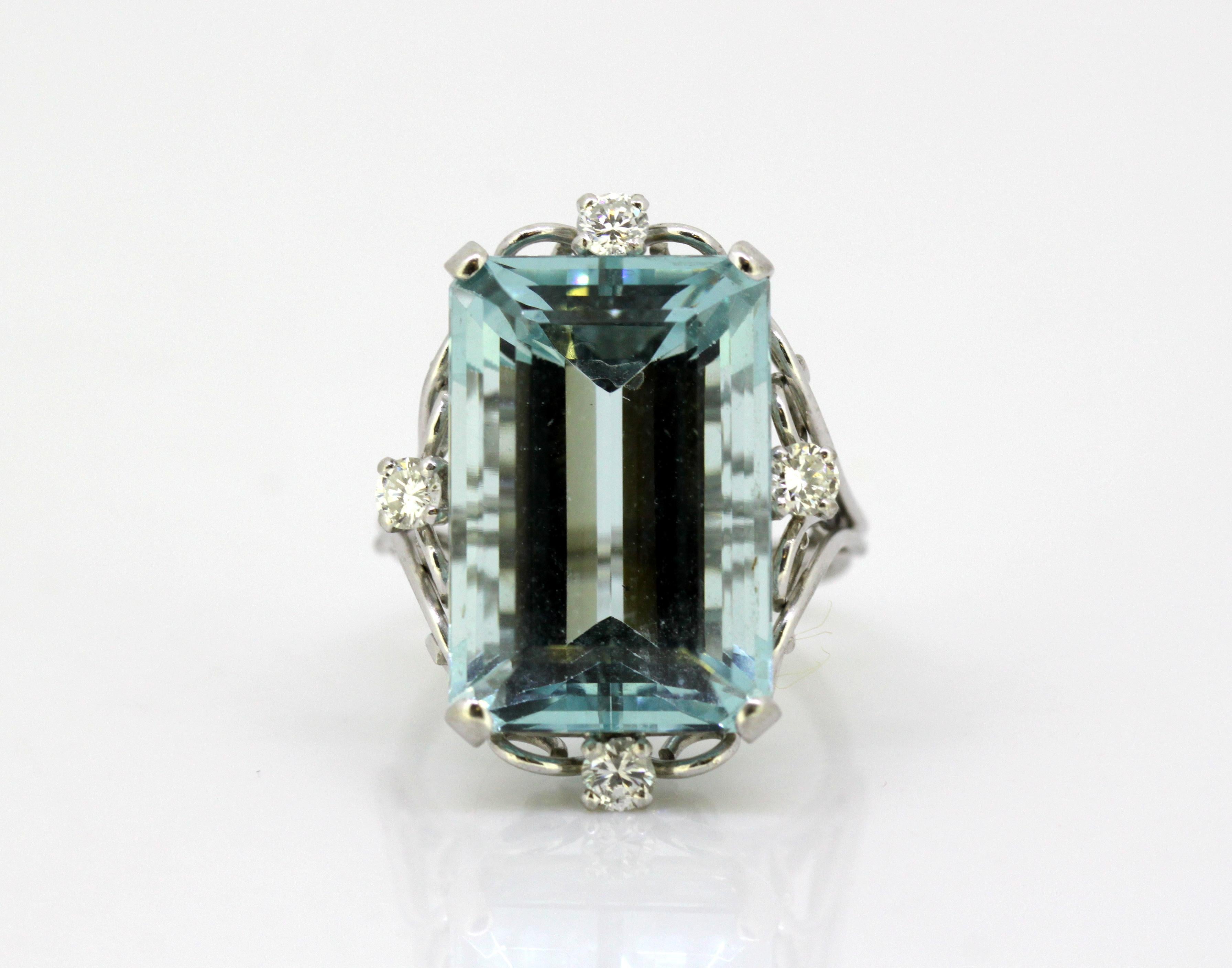 Vintage 18kt white gold ladies ring with natural aquamarine and diamonds.
Made in 1970's.
No hallmark, tested positive for 18k gold.

Dimensions -
Finger Size: (UK) = J (US) = 5 1/4 (EU) = 49 1/2
Size :  2.9 x 2.2 x 2.5 cm
Weight: 11 grams