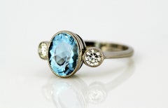 Vintage 18 Karat White Gold Ladies Three-Stone Ring with Aquamarine and Diamonds