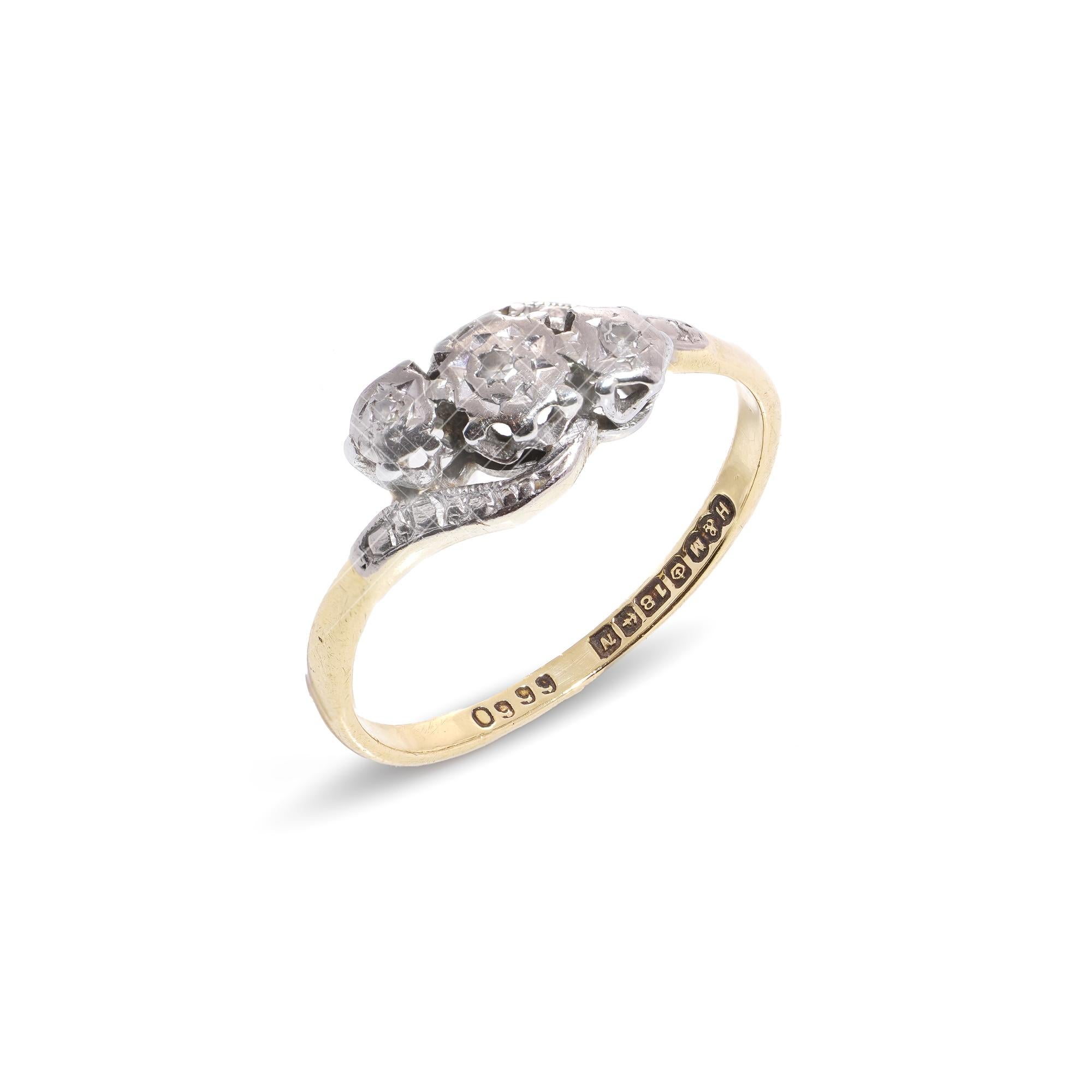 Vintage 18kt yellow and white gold diamond ring.
Made in England, Birmingham, 1987
Fully hallmarked.

Dimensions -
Finger Size (UK) = K 1/2 (EU) = 52.5 (US) = 5.75
Weight: 2.00 grams

Diamonds -
Cut: Round brilliant
Quantity of stones: 3
Carat