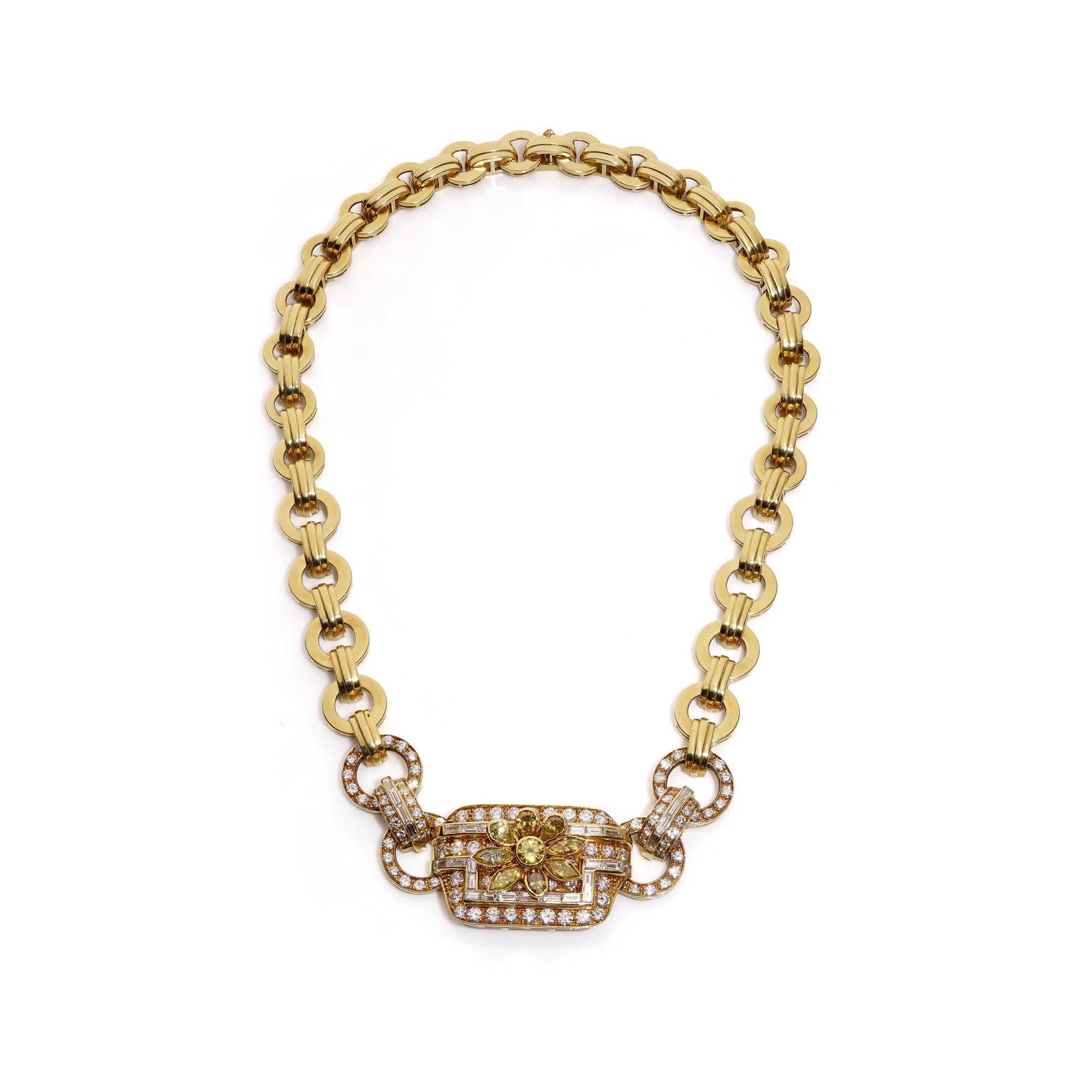 Vintage 18kt yellow collar necklace with fancy yellow and white diamonds.

Dimensions -
Necklace Length: 42.5 cm
Weight: 91 grams

Diamonds -
Quantity: 115
Cut: Round brilliant, baguette, pear, marquise
Carat weight: 9.23 cts. in total
Clarity: