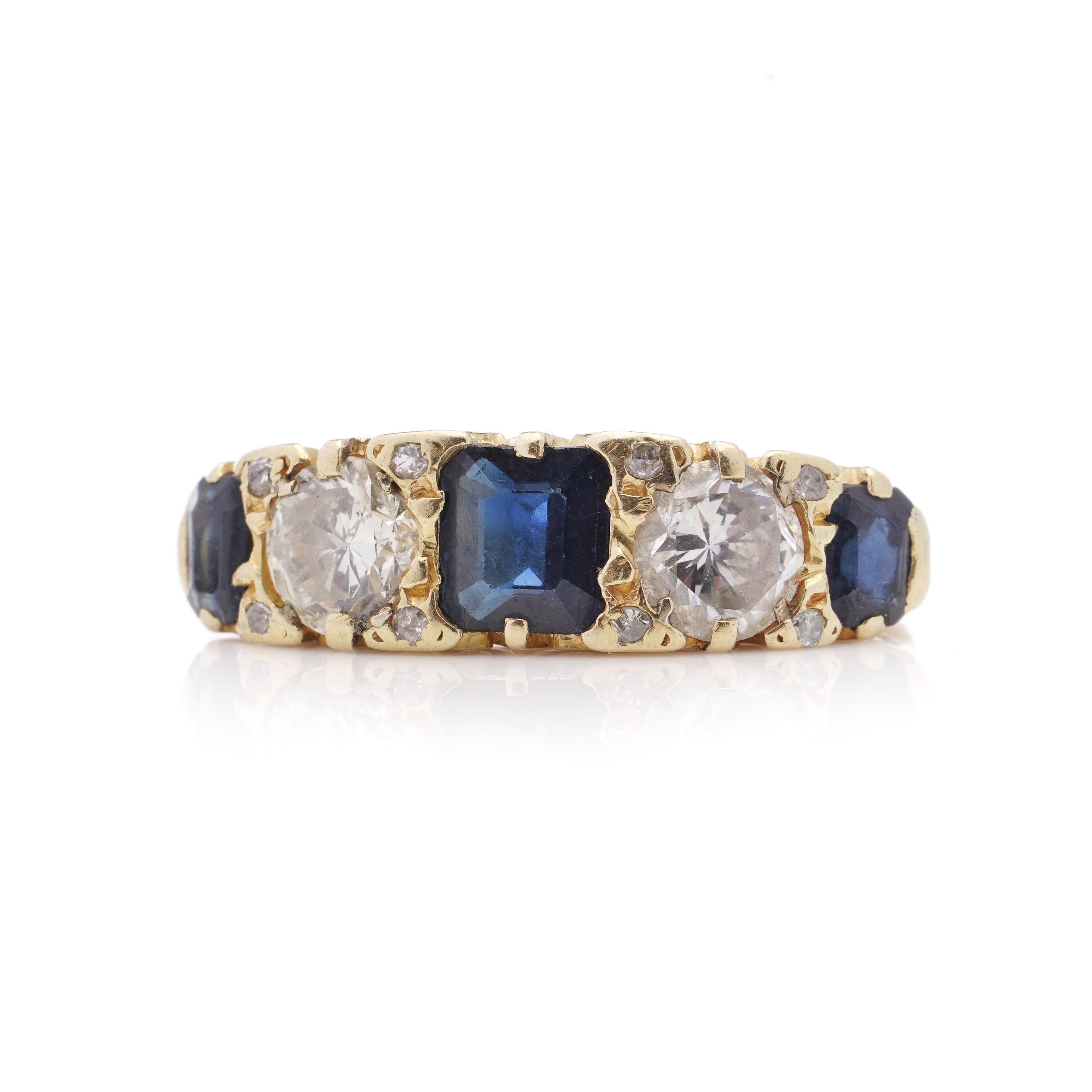 Vintage 18kt yellow gold 5 stone ladies ring with 1.55 carats square - cut sapphires  and 1.50 carats round brilliant diamonds. 
Tested positive for 18kt. yellow gold. 
The ring has scroll gallery decoration. 

Made in England, Circa 1970's, in