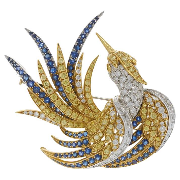 Broche vintage de oro amarillo de 18 quilates con diamantes amarillos y zafiros azules