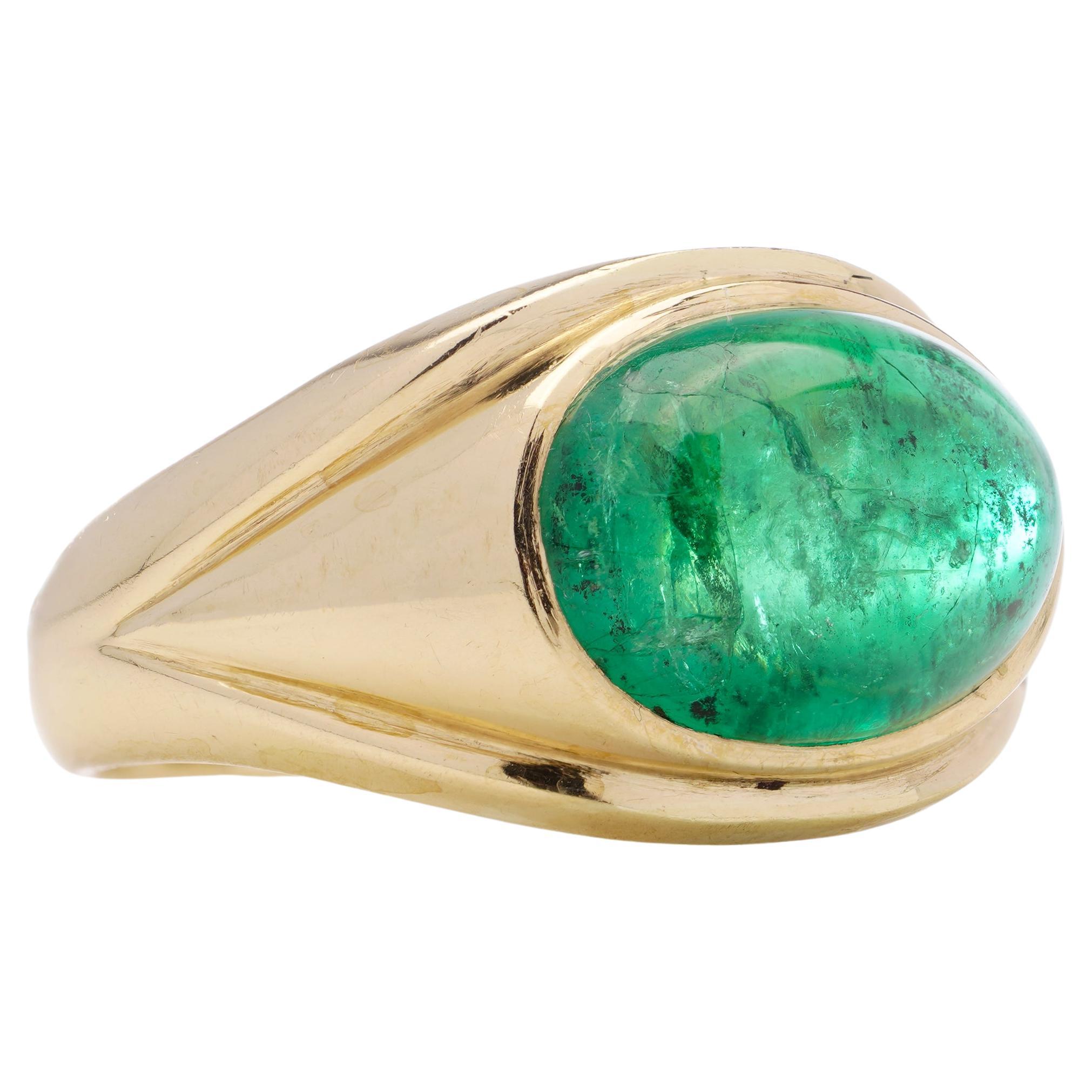 Vintage 18kt yellow gold dome ring set with oval 3.95ct. cabochon Emerald.
Made in the United Kingdom, London, 1969
Maker: W Wilkinson Ltd.
Fully hallmarked ( Partial marks faded but still clear to read )

* Please note: customs and import charges