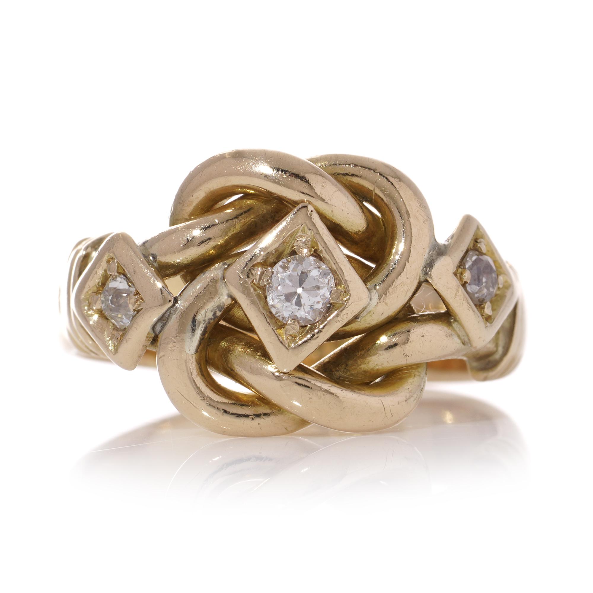 Vintage 18kt yellow gold knot design three-stone 0.20 carats of diamond ring. 
Made in England, London, 1974
Fully hallmarked. 

Dimensions - 
Finger Size (UK) = P 1/2 (EU) = 57.5  (US) = 8.5 
Weight: 9.2 grams
Ring size: 

Diamonds - 
Cut: Old -