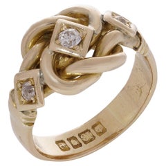Retro 18kt yellow gold knot design three-stone 0.20 carats of diamond ring