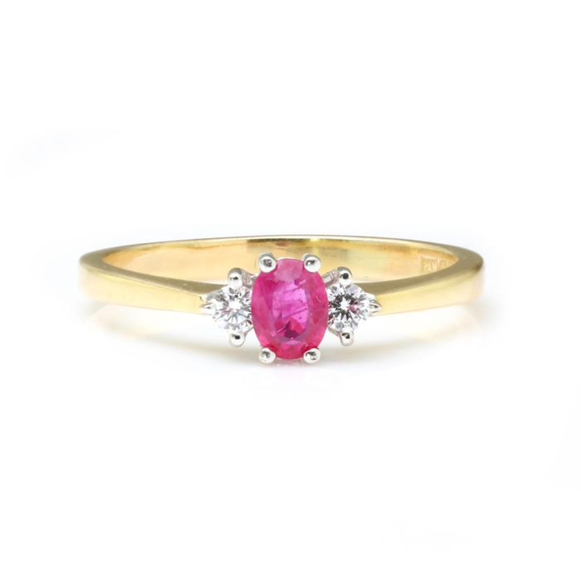 Vintage 18kt yellow gold ladies ring with natural ruby and diamonds
Made in England, Circa 1990's
Hallmarked 750

Dimensions -
Finger Size (UK) = R (US) = 8 3/4 (EU) = 58 1/2
Ring Size; 2.6 x 2.2 x 0.6 cm
Weight: 3.23 grams

Ruby - 
Cut: Oval
Approx