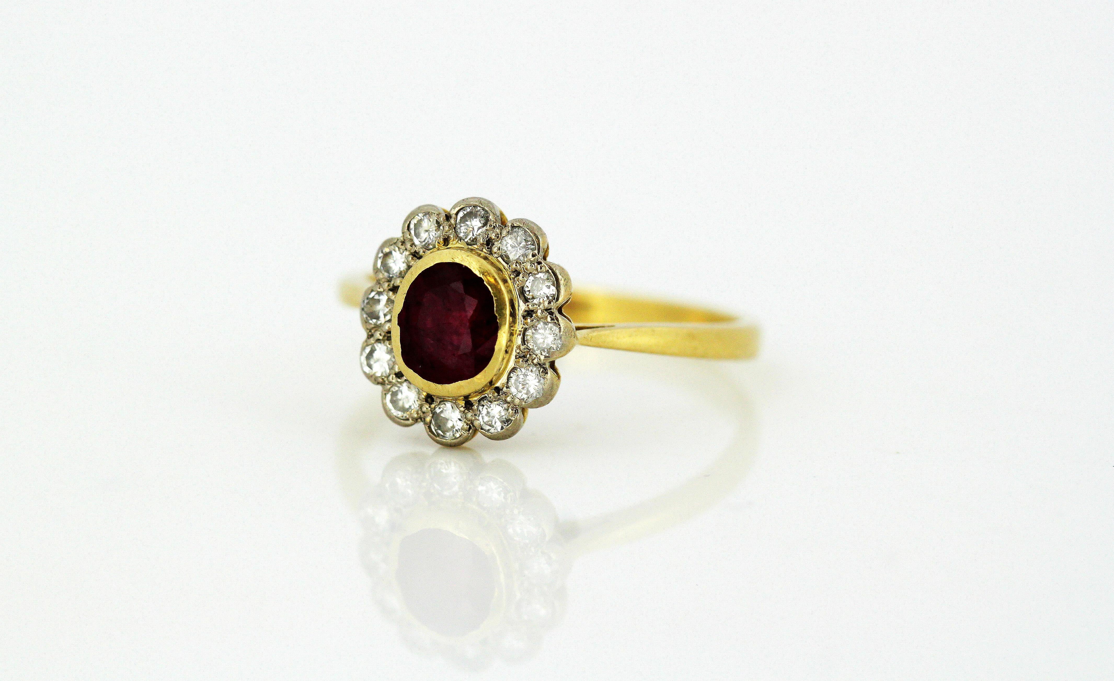 Vintage 18kt yellow gold ladies ring with natural ruby and diamonds.
Made in London 1985
Makers Mark : KC
Fully hallmarked 18kt gold.

Dimensions -
Finger Size : (UK) = P (US) = 8 (EU) = 56 1/4
Ring Size : 2.4 x 2.1 x 1.2 cm
Weight: 3 grams