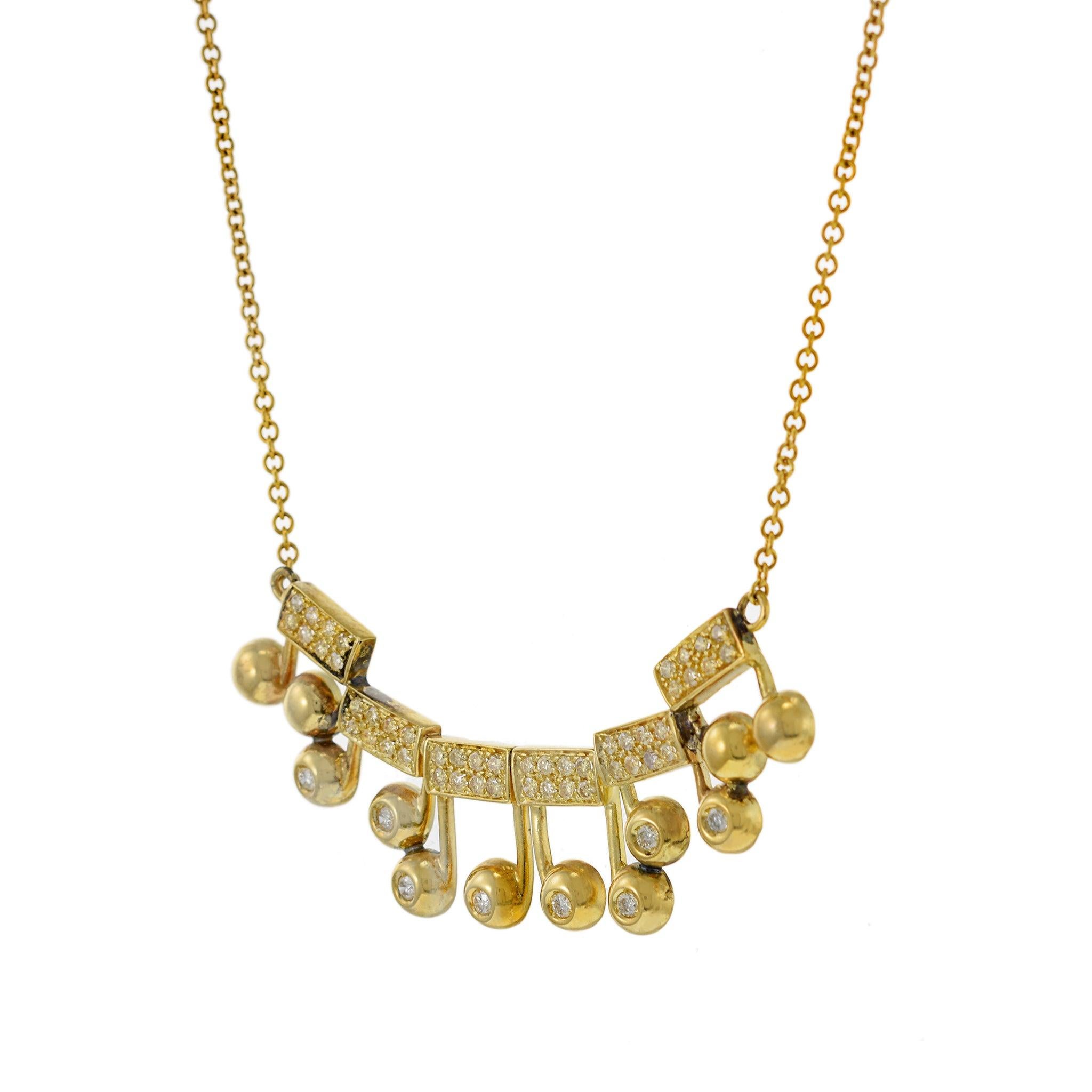 Vintage 18KT Yellow Gold Musical Notes Charm Necklace with Diamonds In Excellent Condition For Sale In New York, NY