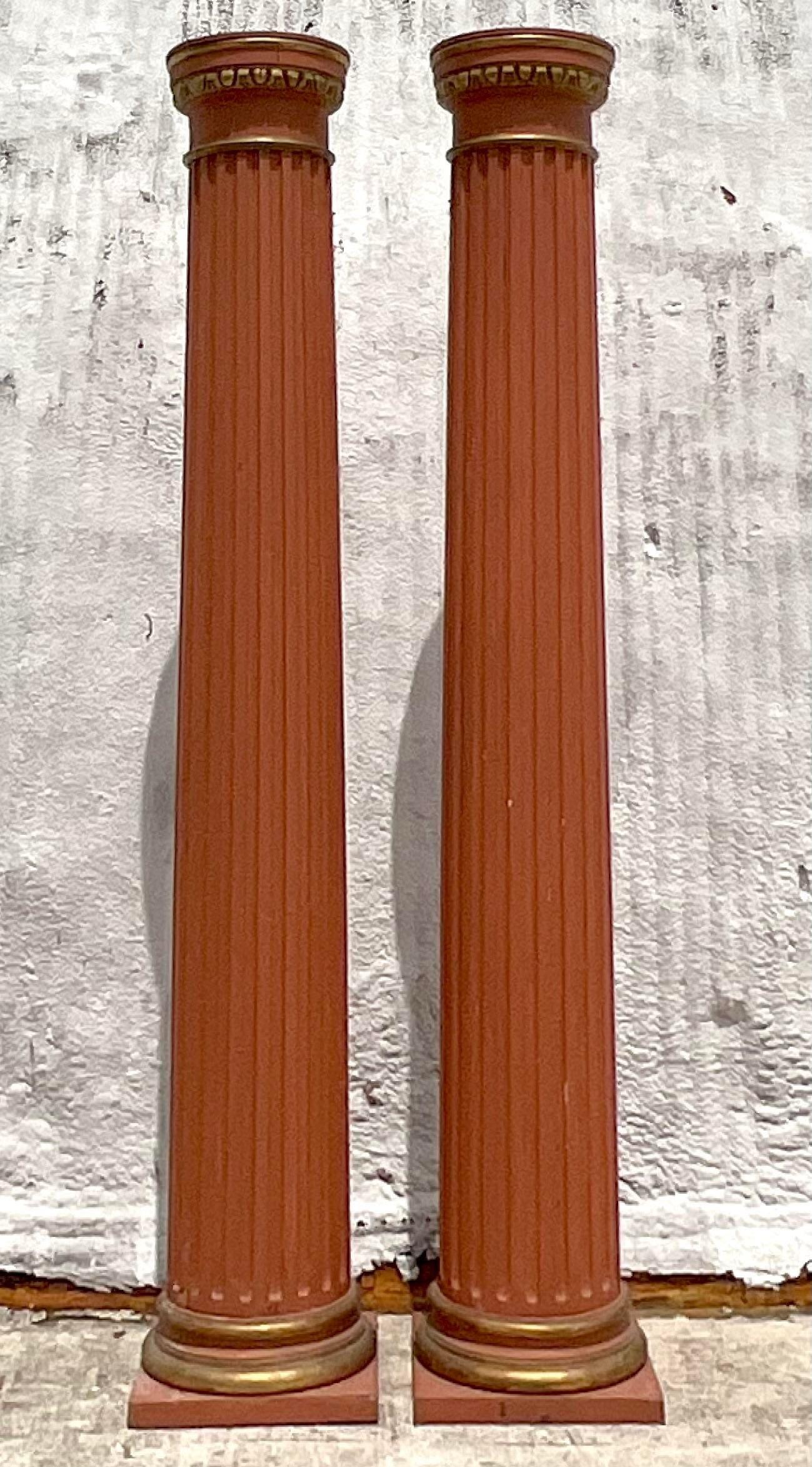 A fabulous pair of vintage Boho wood columns. Made in the 18th century and have all the glorious patina from time. Separate into three pieces for easy movement. Acquired from a Palm Beach estate.