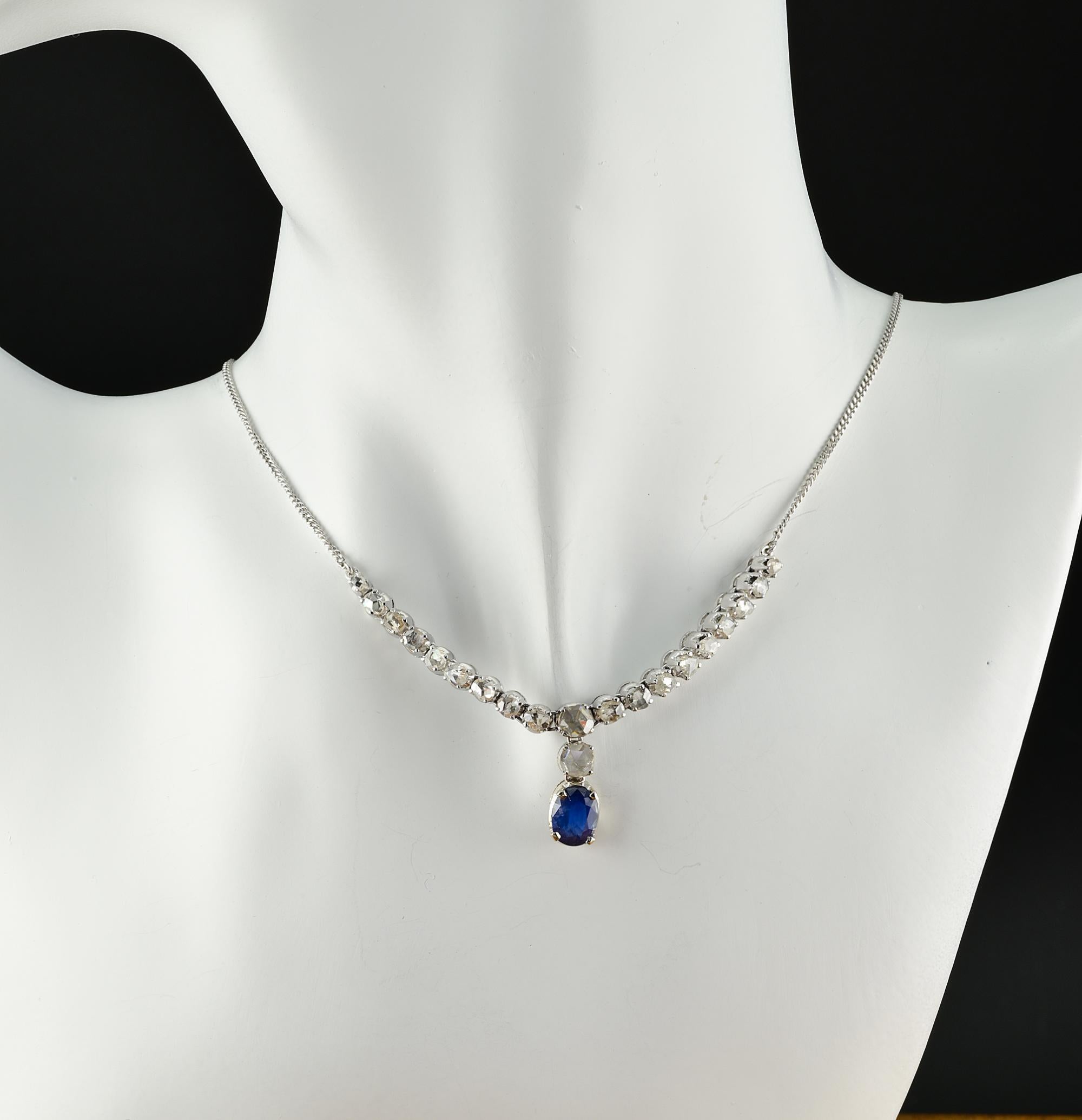 This lovely vintage necklace is 1940 ca
Beautifully hand crafted of solid 18 Kt white gold
Bearing Italian hallmarks from the period
Gorgeous half neck Rose cut Diamond line with centre finial drop set with Rose cut Diamonds and natural Sapphire for