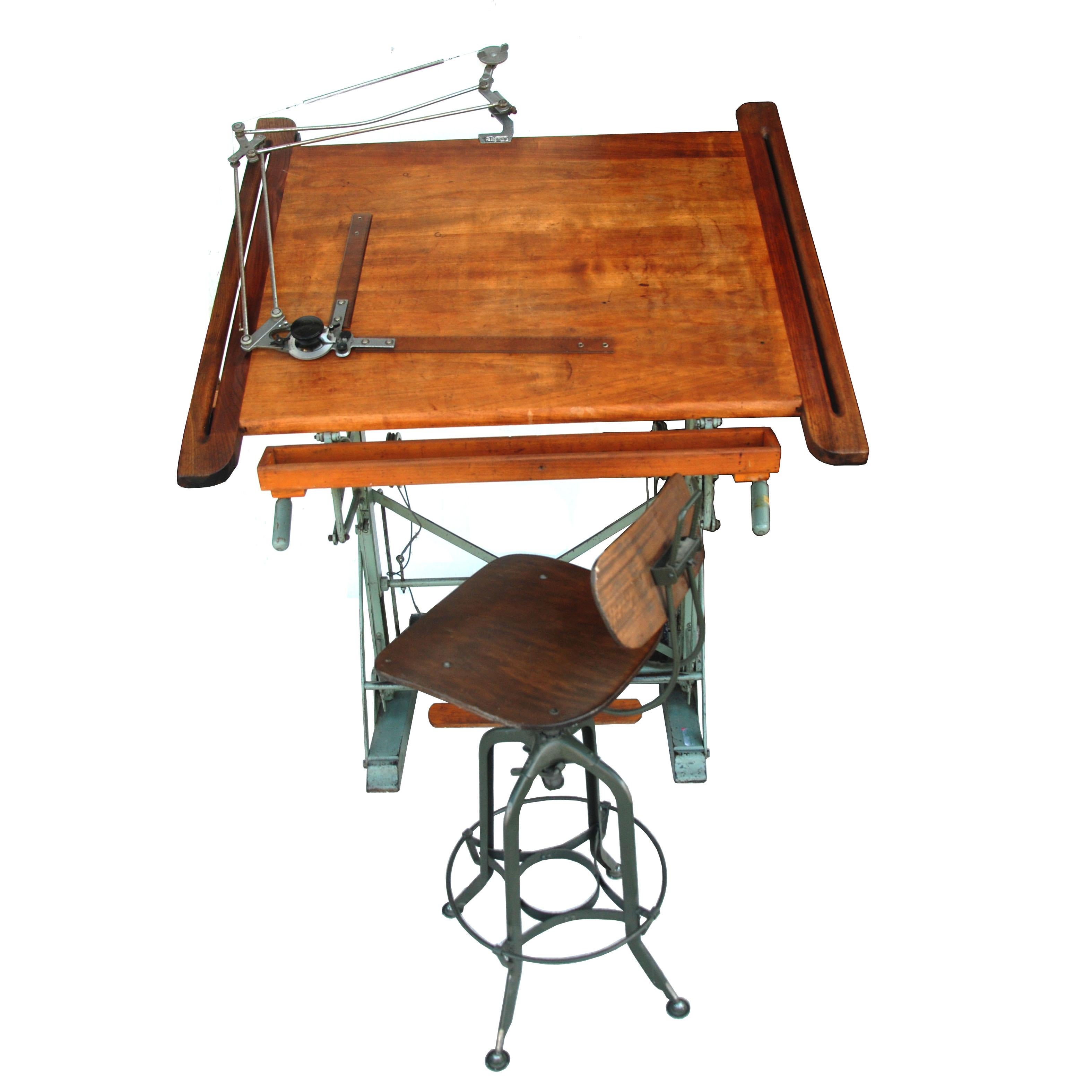 Attributed to Kahn Freres, 1900s. 

Rare antique French adjustable industrial drafting table. Original green metal base and rich patina wood top. Pencil tray. Original weight mechanism at the base.

Drafting tools are included.
Vintage Toledo