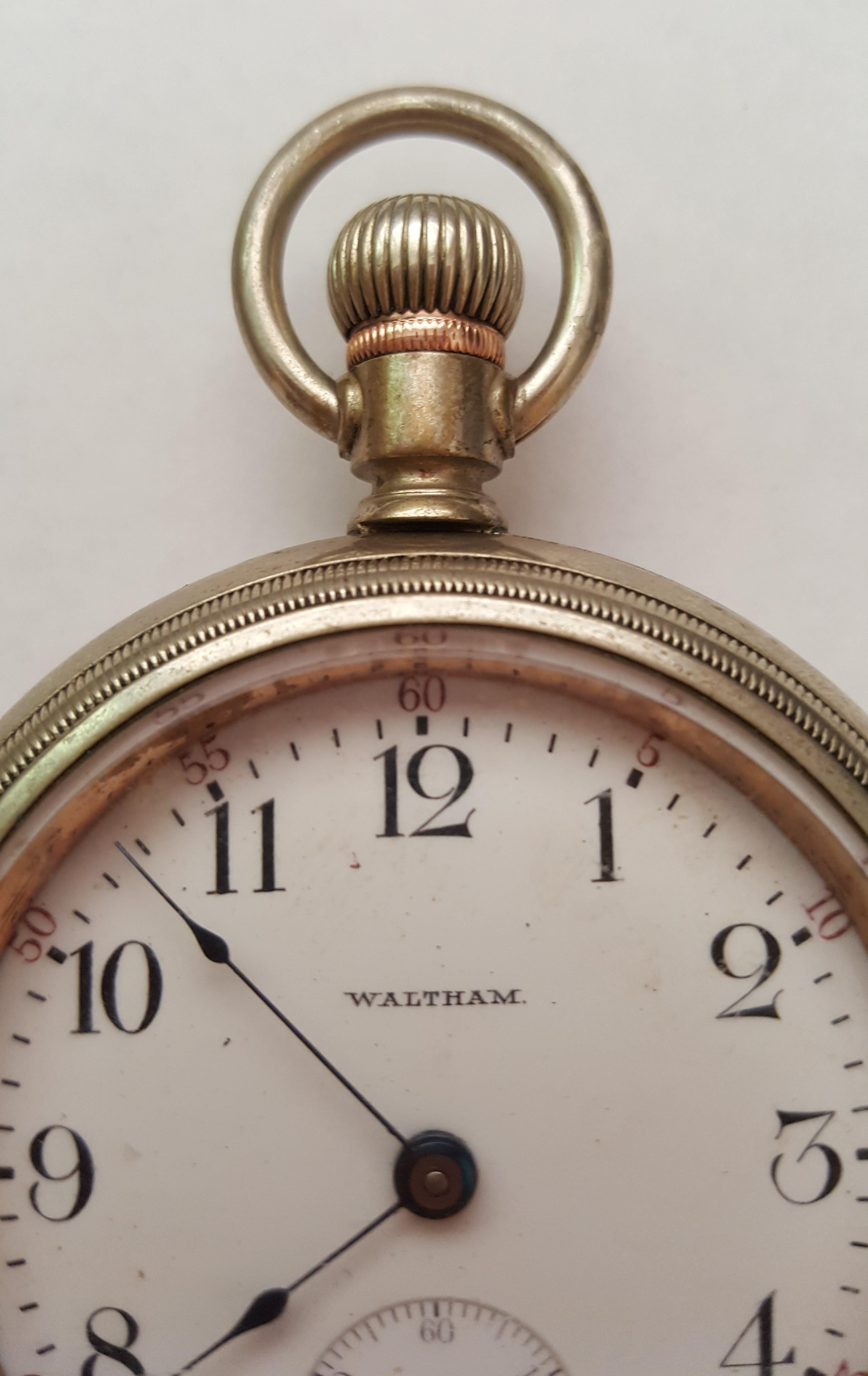 Vintage 1903 Waltham Pocket Watch, Silver, Model 1883, 58mm Case, 20 mm Thick, 46mm Thick Crystal, Brass accent on Winder, Railroad Watch. Adjusted. American Waltham Co. Movement, Serial 12581165

Heavy watch, crystal is in good condition.

This