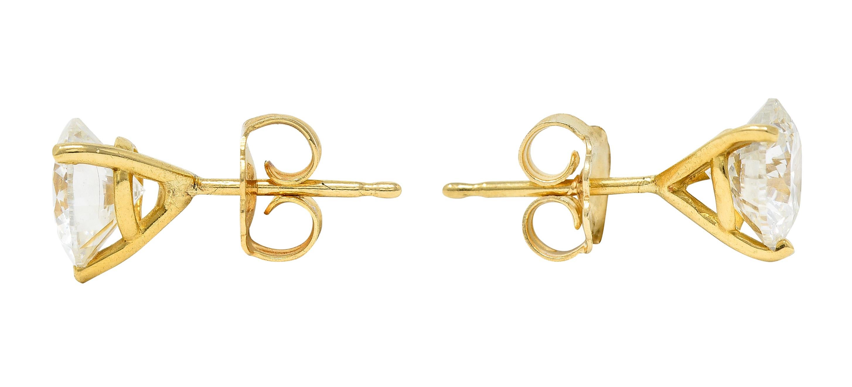 Stud earrings featuring round brilliant cut diamonds

Weighing in total approximately 1.92 carats with H/I color and SI clarity

Basket set in a martini style mounting

Completed by posts and friction backs

Tested as 18 karat gold

Circa: late 20th